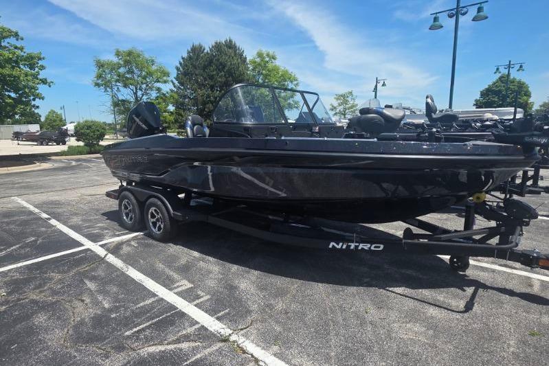 2026 Nitro ZV20 Pro boat on trailer in parking lot under clear sky.
