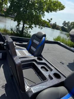 2025 Ranger RT198P boat by lakeside with seating and storage.