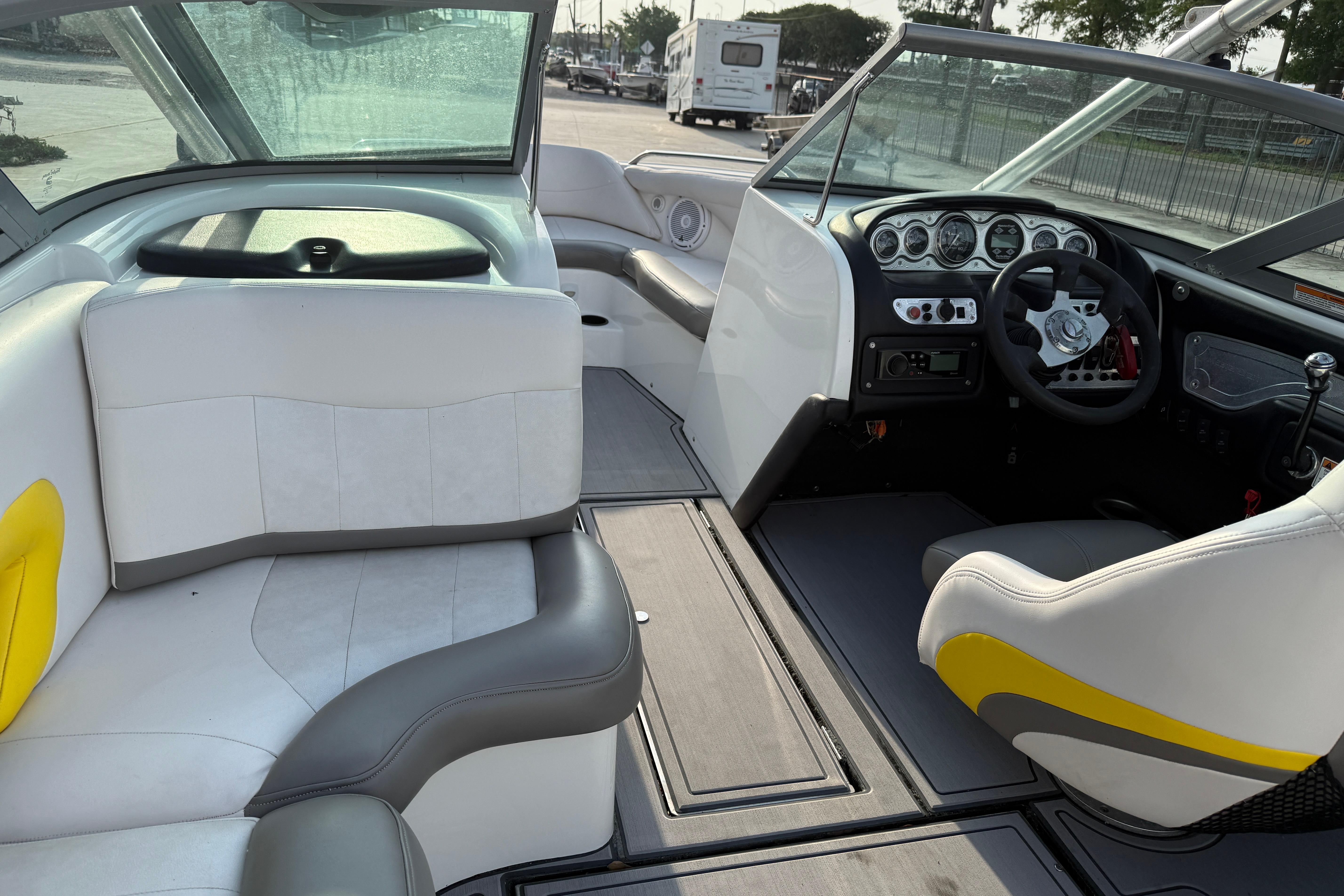Interior of a 2005 MasterCraft X10 boat with white and gray seating.