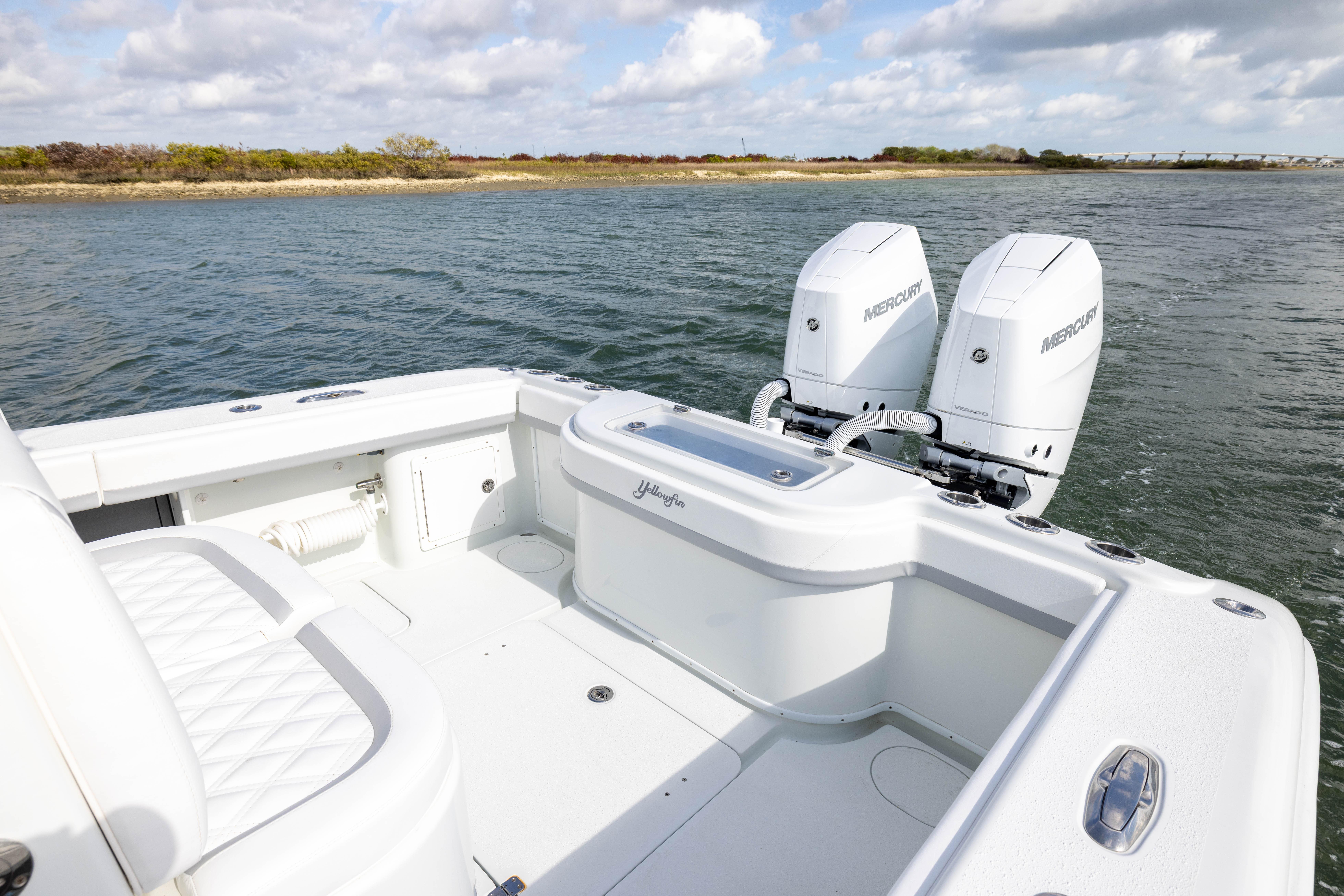 2014 Yellowfin 32 Offshore boat with dual Mercury engines on open water.