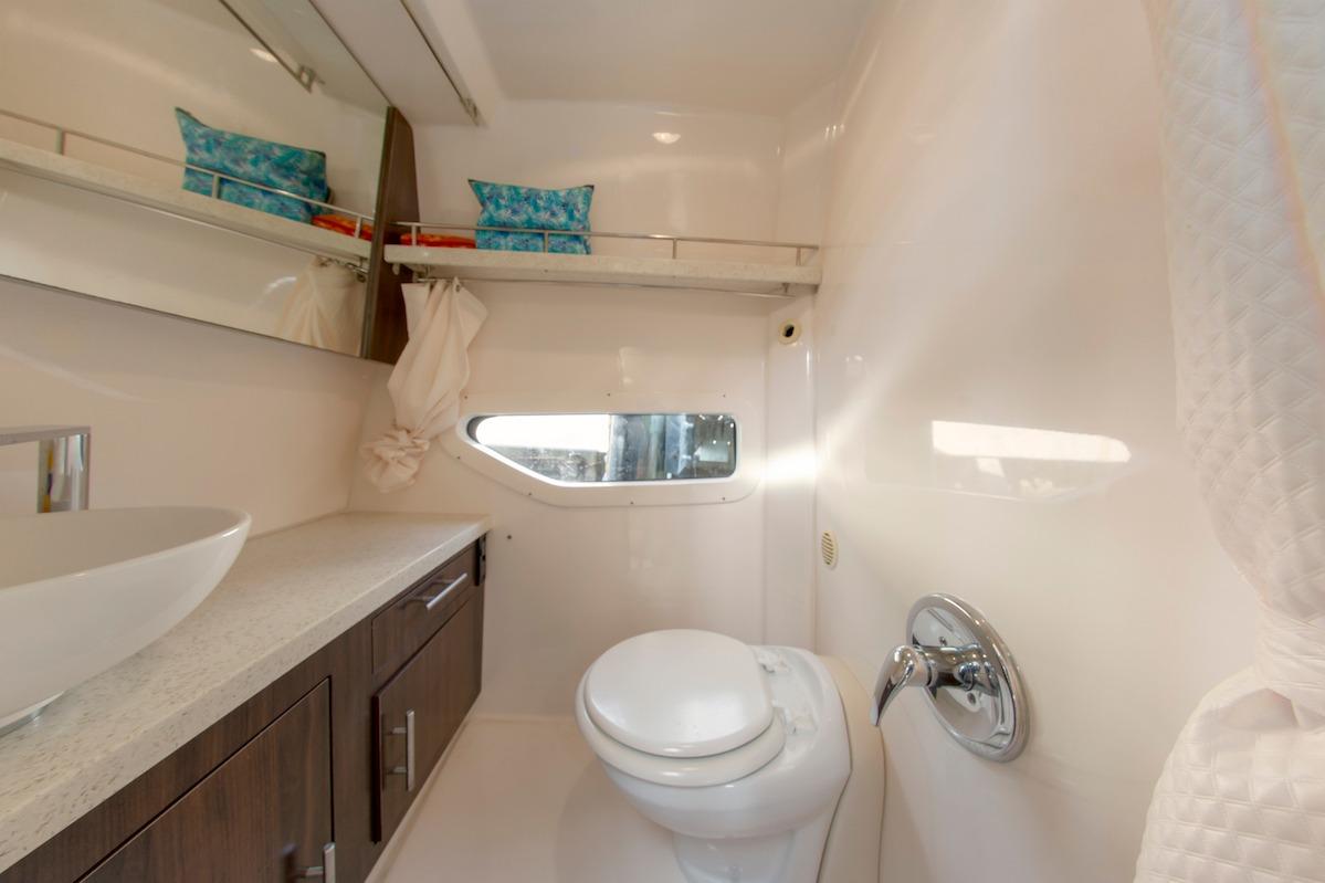 2016 Regal 32 Express yacht bathroom with modern fixtures and sleek design.
