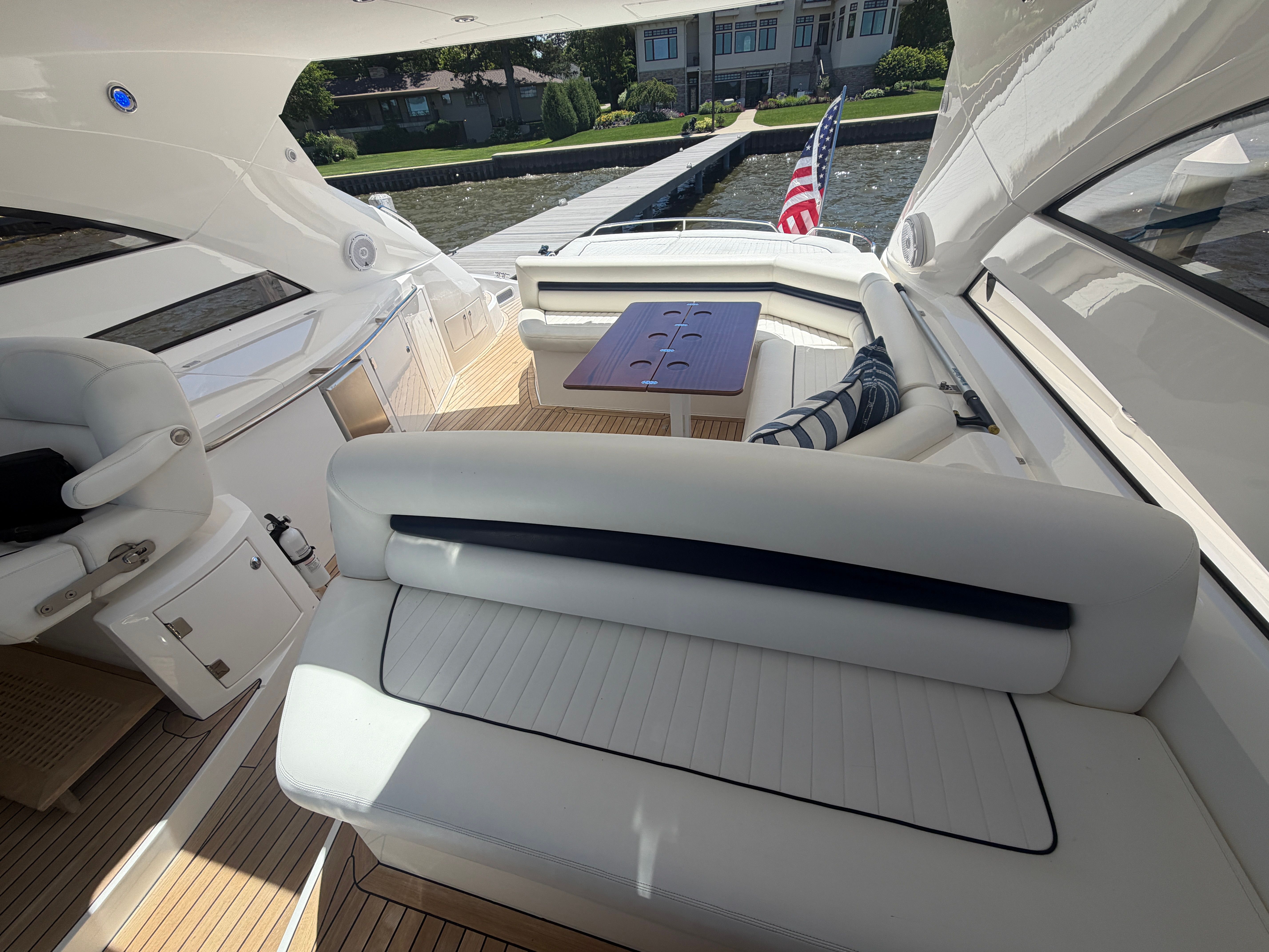 The image shows the cockpit of a 2008 Sunseeker Portofino 53 with elegant white seating.