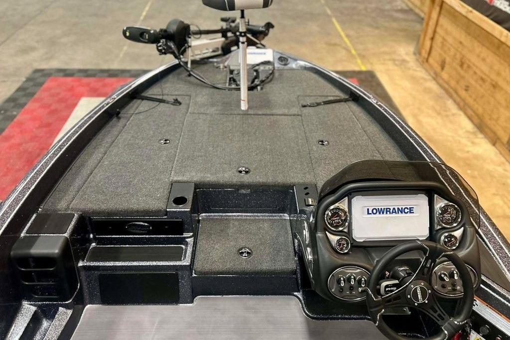 2026 Triton 18 TrX boat dashboard with Lowrance electronics and steering wheel.
