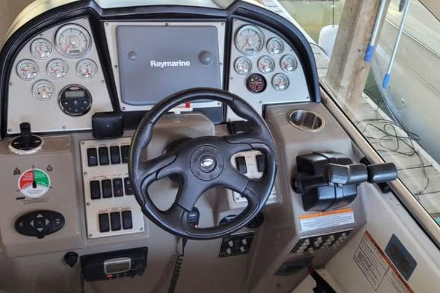 2008 Cruisers Yachts 330 Express helm with Raymarine display and gauges.