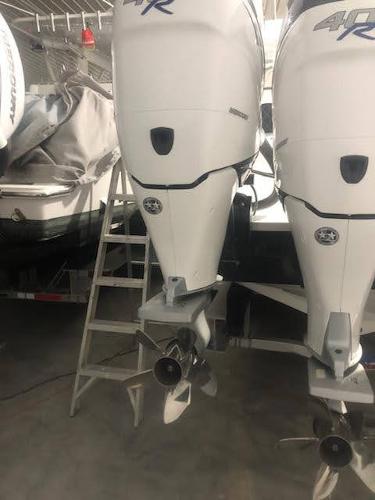 2019 Midnight Express 39 Cuddy boat engines in storage, featuring dual outboard motors.