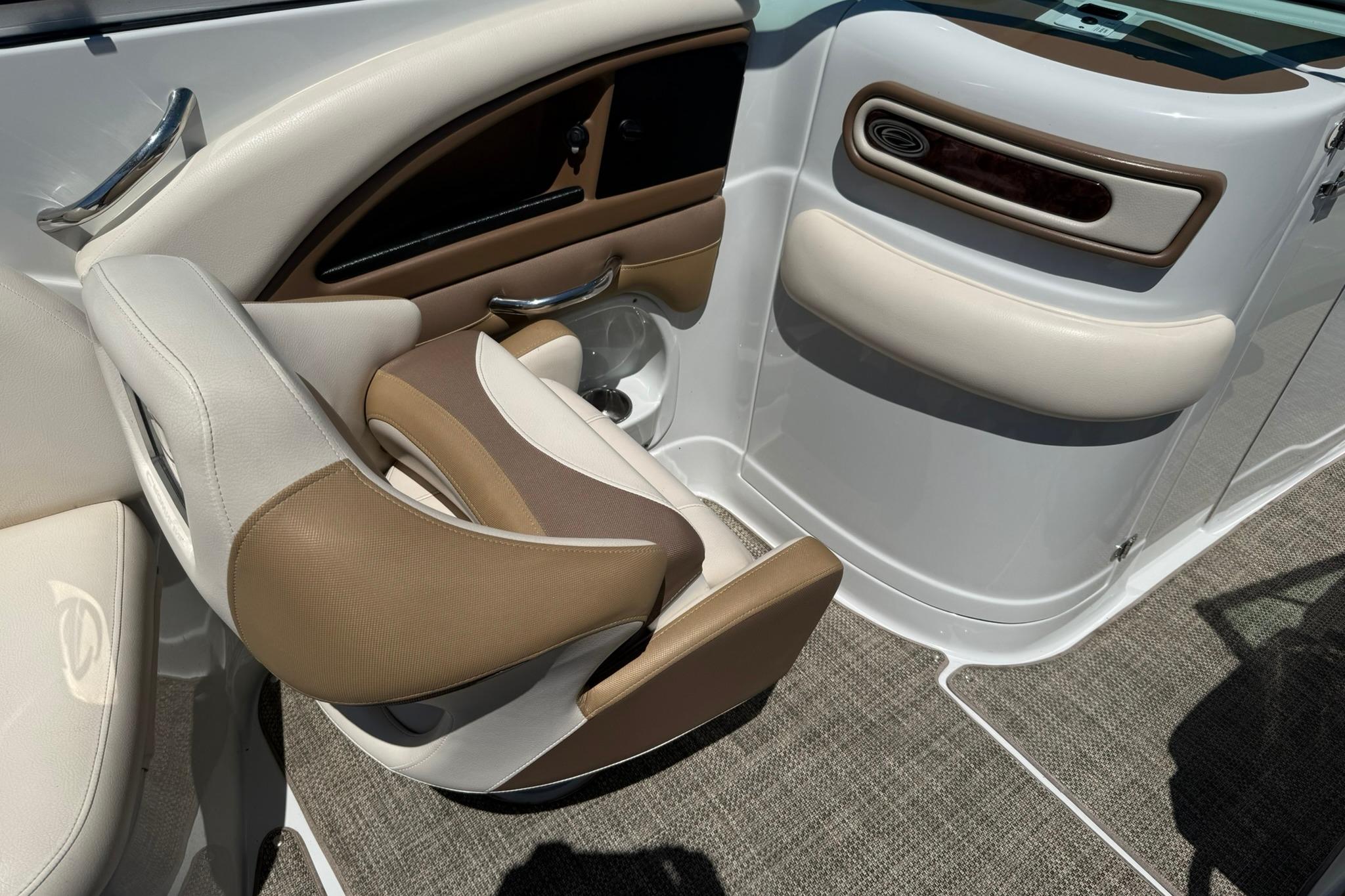 2016 Crownline 255 SS boat interior with beige and white seating.