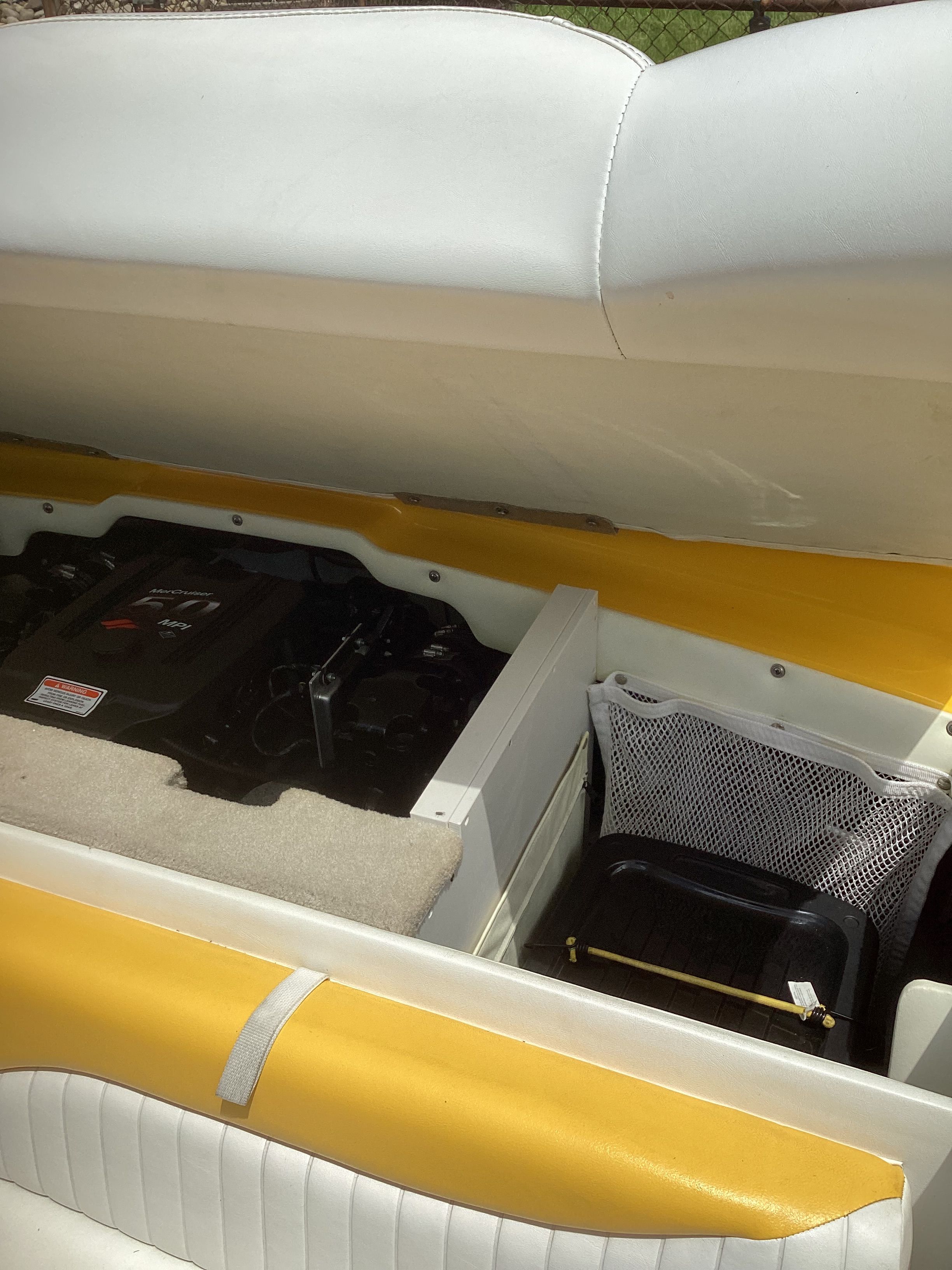 Interior of a 2005 Crownline 202 BR LPX boat with engine cover.
