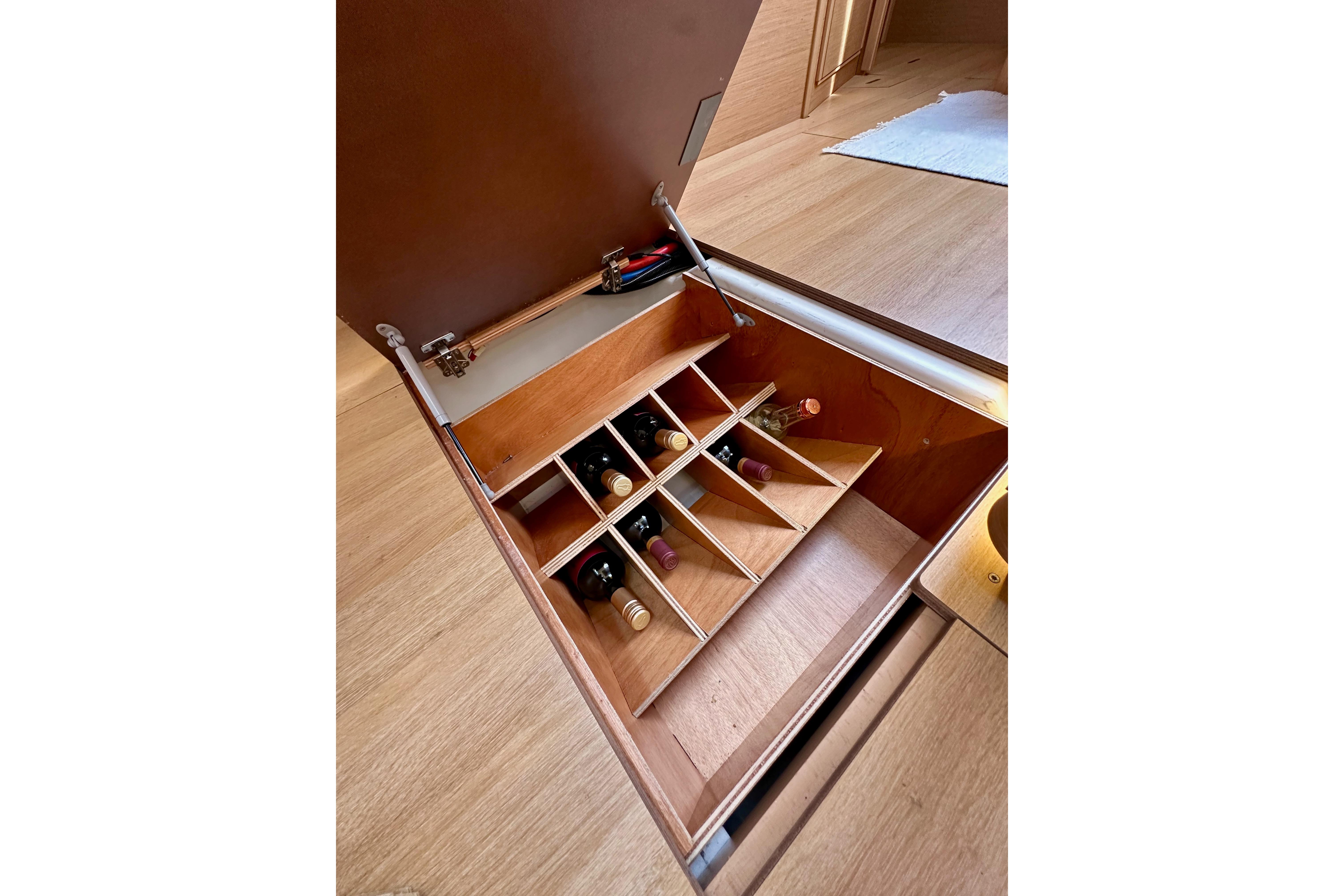 Wine storage compartment in 2024 Jeanneau Sun Odyssey 410 yacht interior.