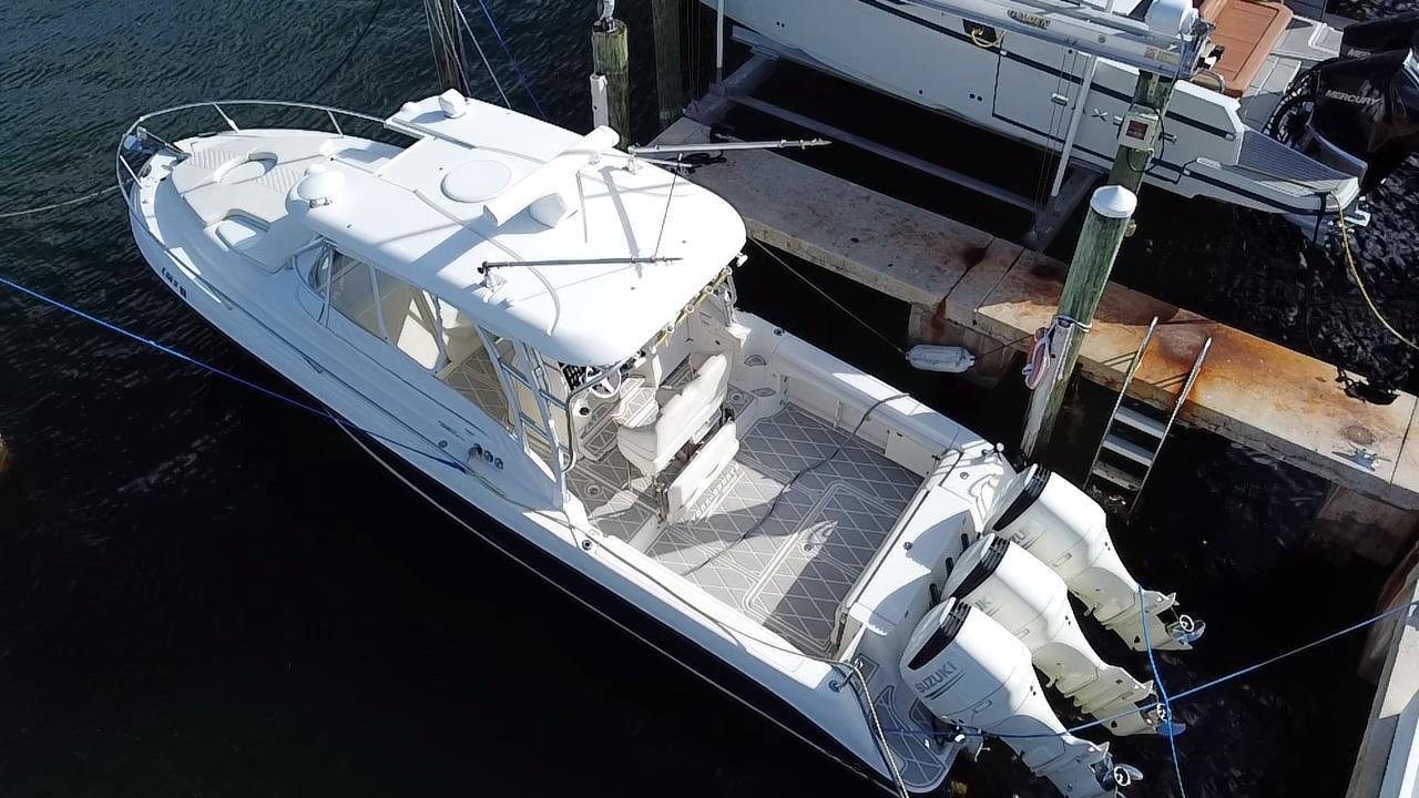 2006 Hydra-Sports Vector 3300 VX boat docked with twin outboard engines.