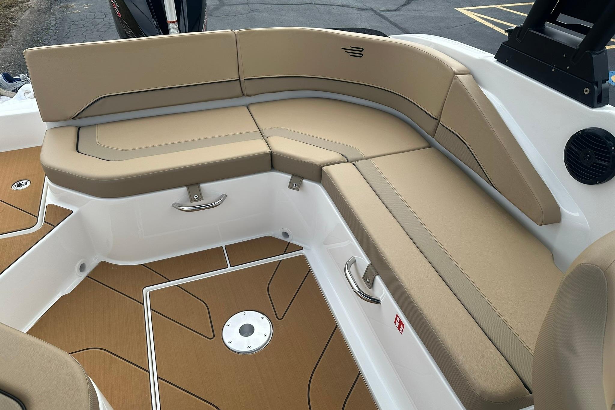 2026 Bayliner V20 boat interior with tan seating and sleek design.