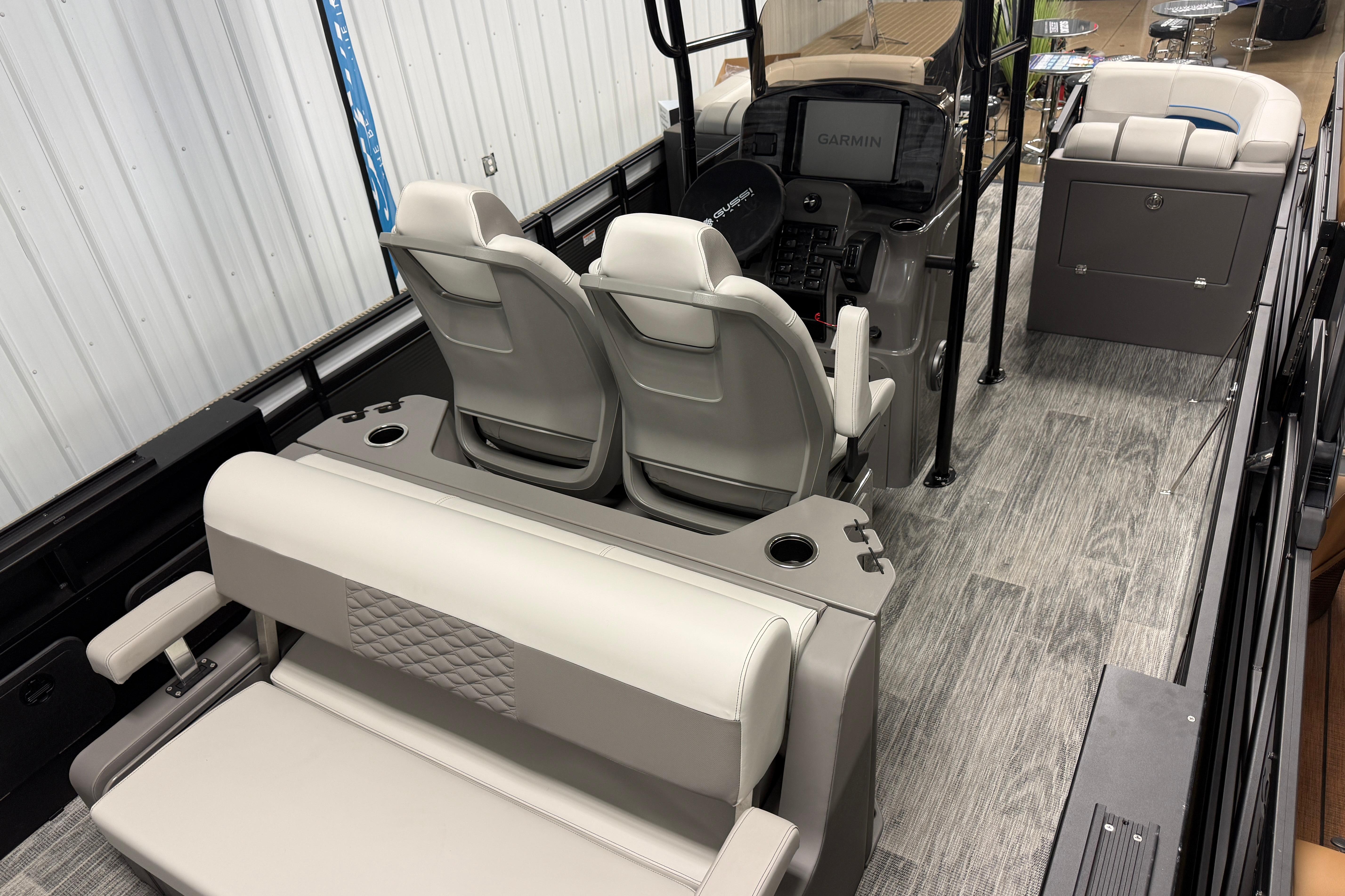 2026 Qwest M-Class 22 Pro Sport boat interior with modern seating and control panel.