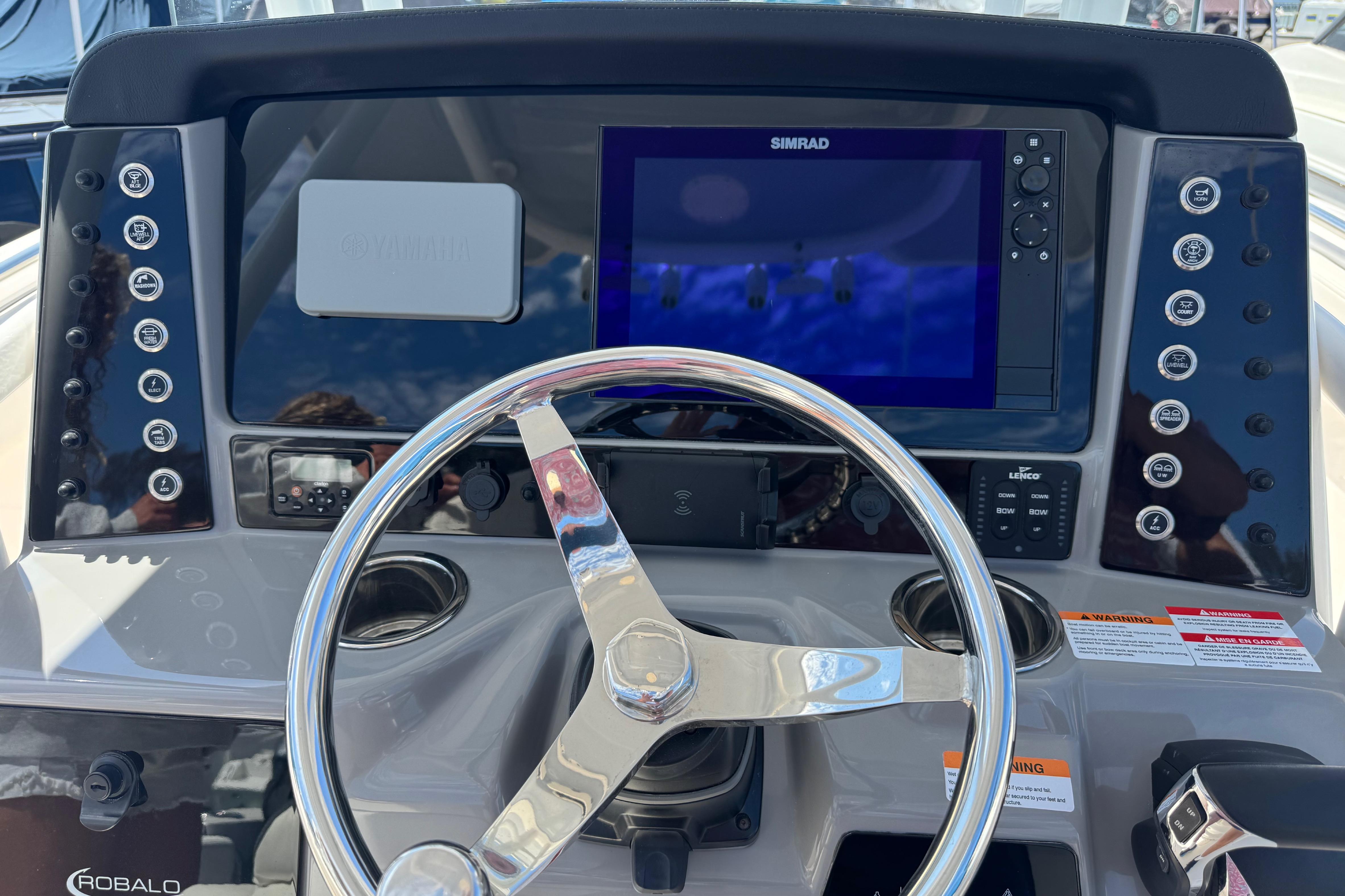 2022 Robalo R230 Center Console dashboard with steering wheel and Simrad display.