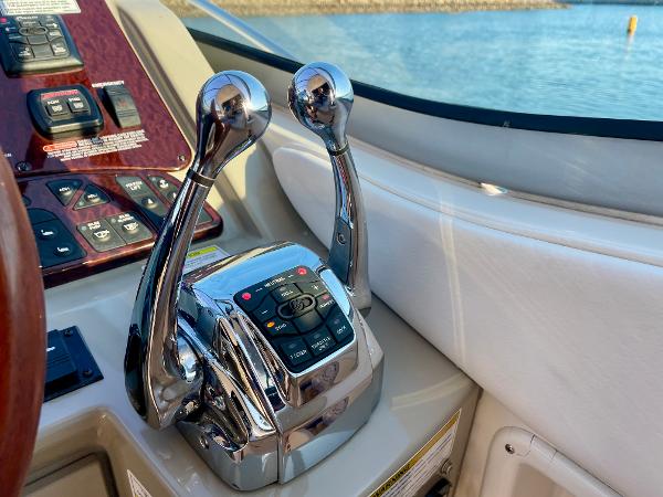 Chrome throttle controls on 2014 Sea Ray 330 Sundancer boat dashboard.