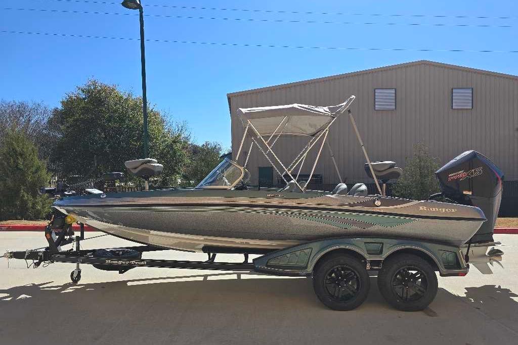 2026 Ranger 212LS boat on trailer, parked outdoors under clear blue sky.