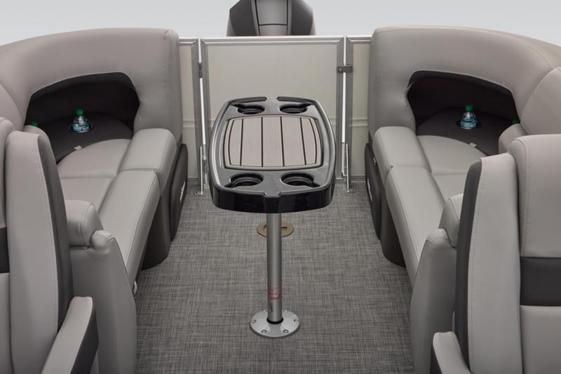 2026 Sun Tracker Party Barge 22 DLX interior with seating and table.