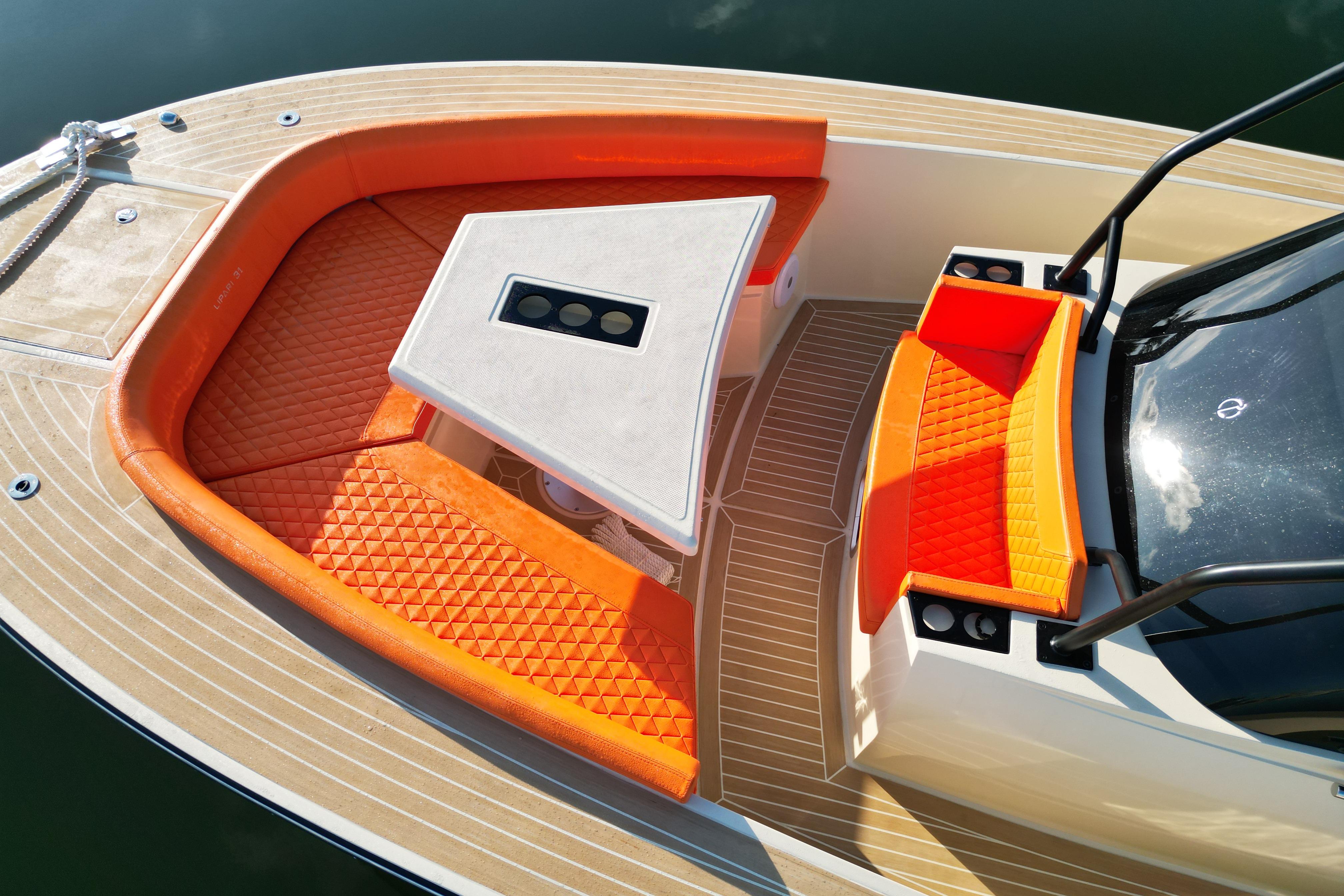 2026 Lilybaeum Lipari 31 boat interior with orange seating and modern design.