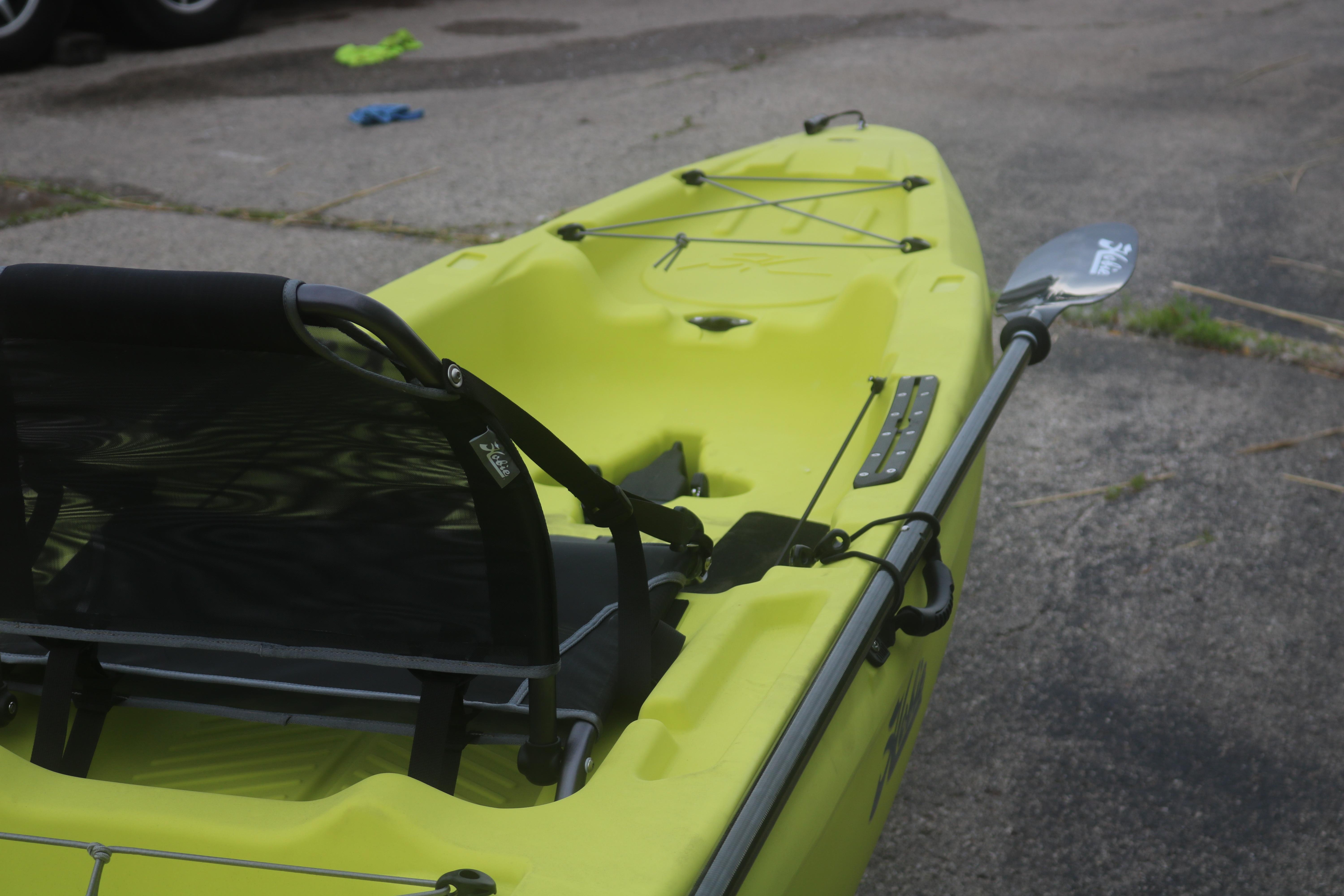 Yellow Hobie Mirage Passport 12.0 R kayak, 2025 model, with paddle on pavement.
