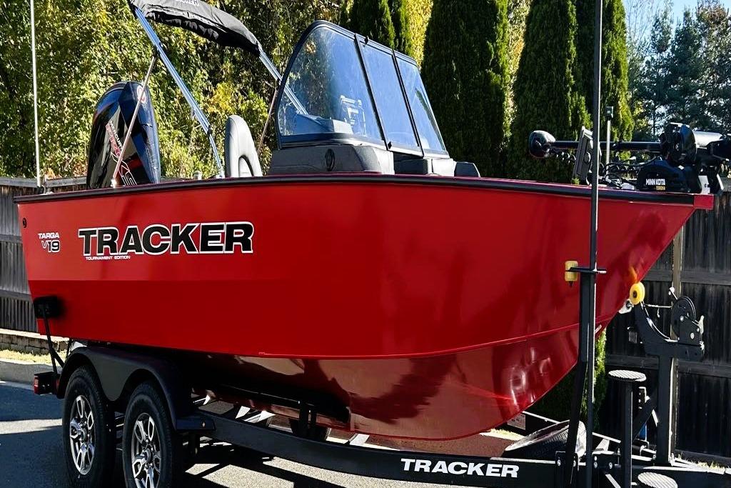 2026 Tracker Targa V-19 Combo boat in vibrant red on trailer.