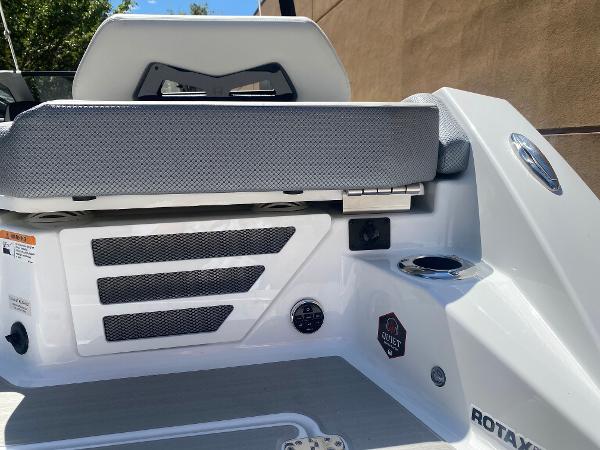 2025 Scarab 235 SE boat interior with seating and control panel.