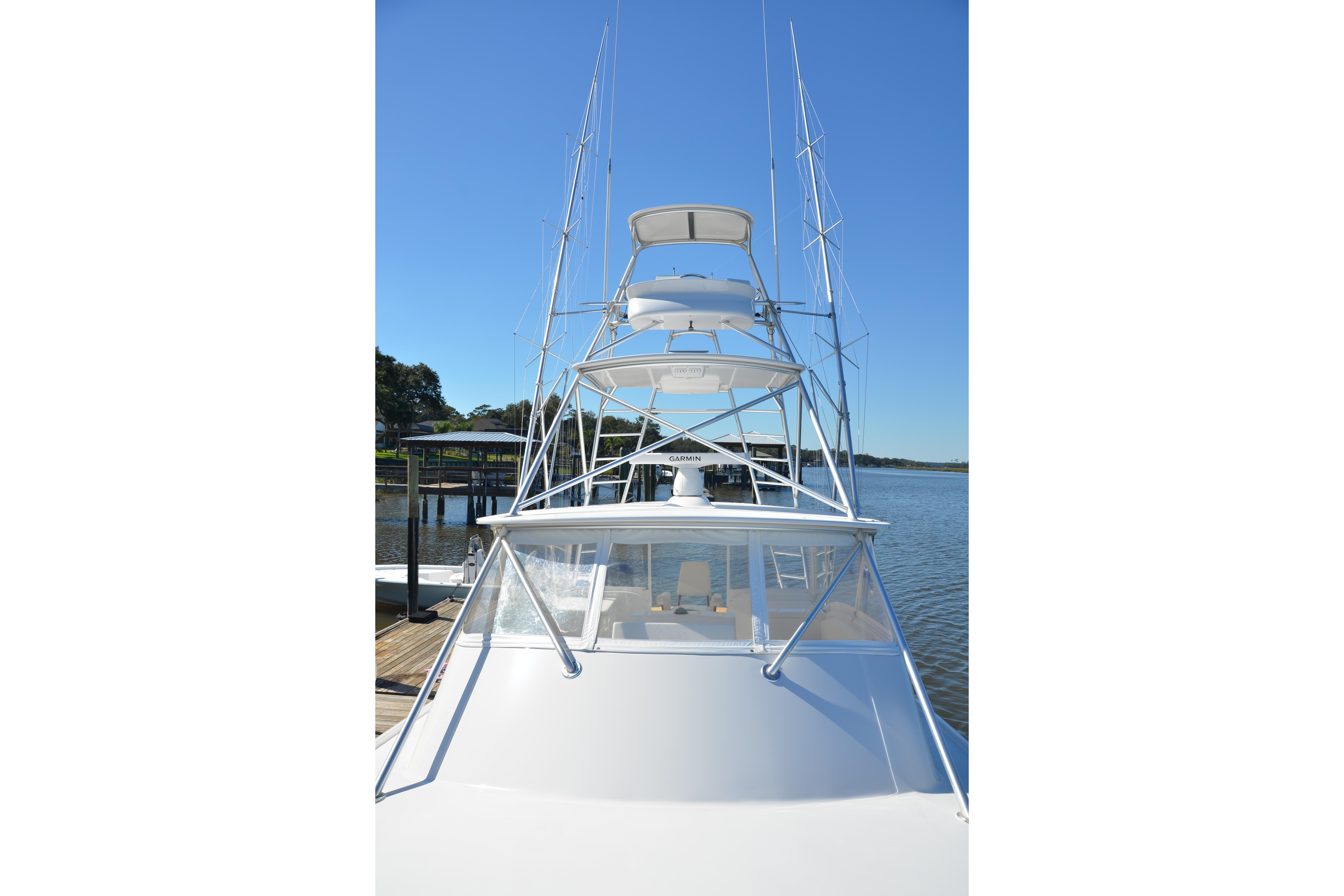 2006 Custom Carolina Heritage Express boat docked on a sunny day.