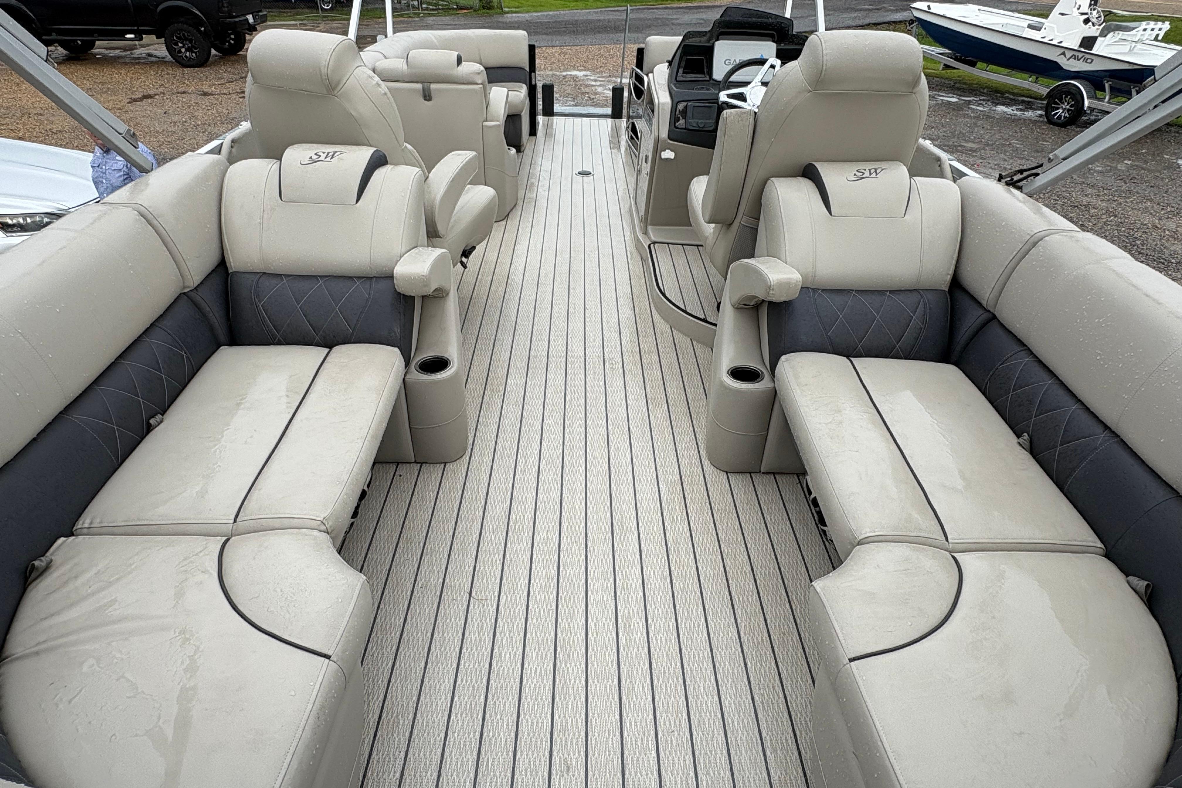Luxurious interior of 2023 SilverWave 2410 CLS pontoon boat with plush seating and modern design.
