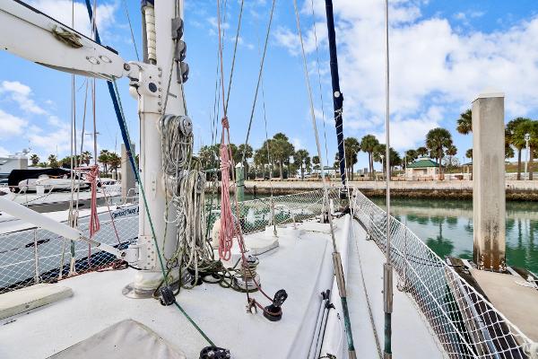 1989 Concordia 52 sailboat docked at a marina with clear skies.