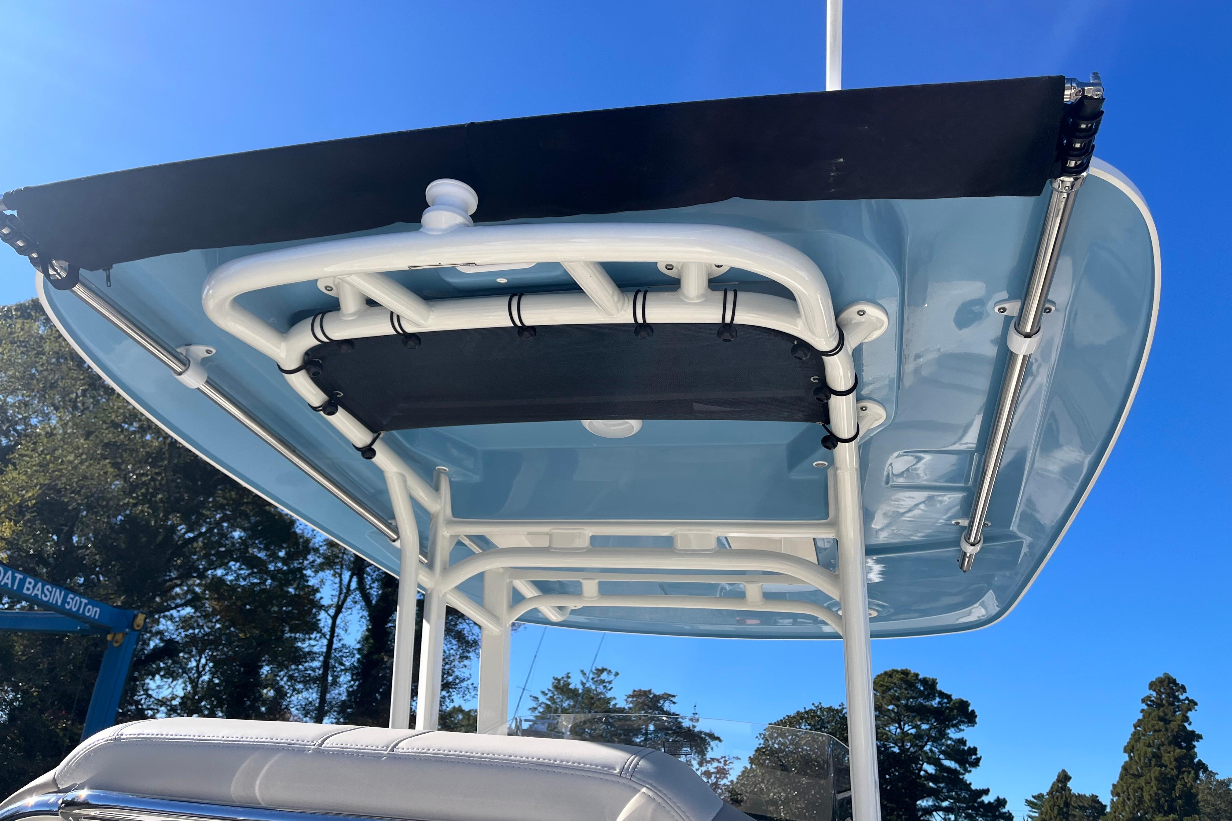 2026 Boston Whaler 280 Dauntless boat canopy against clear blue sky.