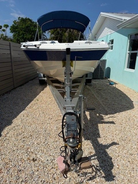 2020 Nautic 203SC boat on trailer parked in driveway.