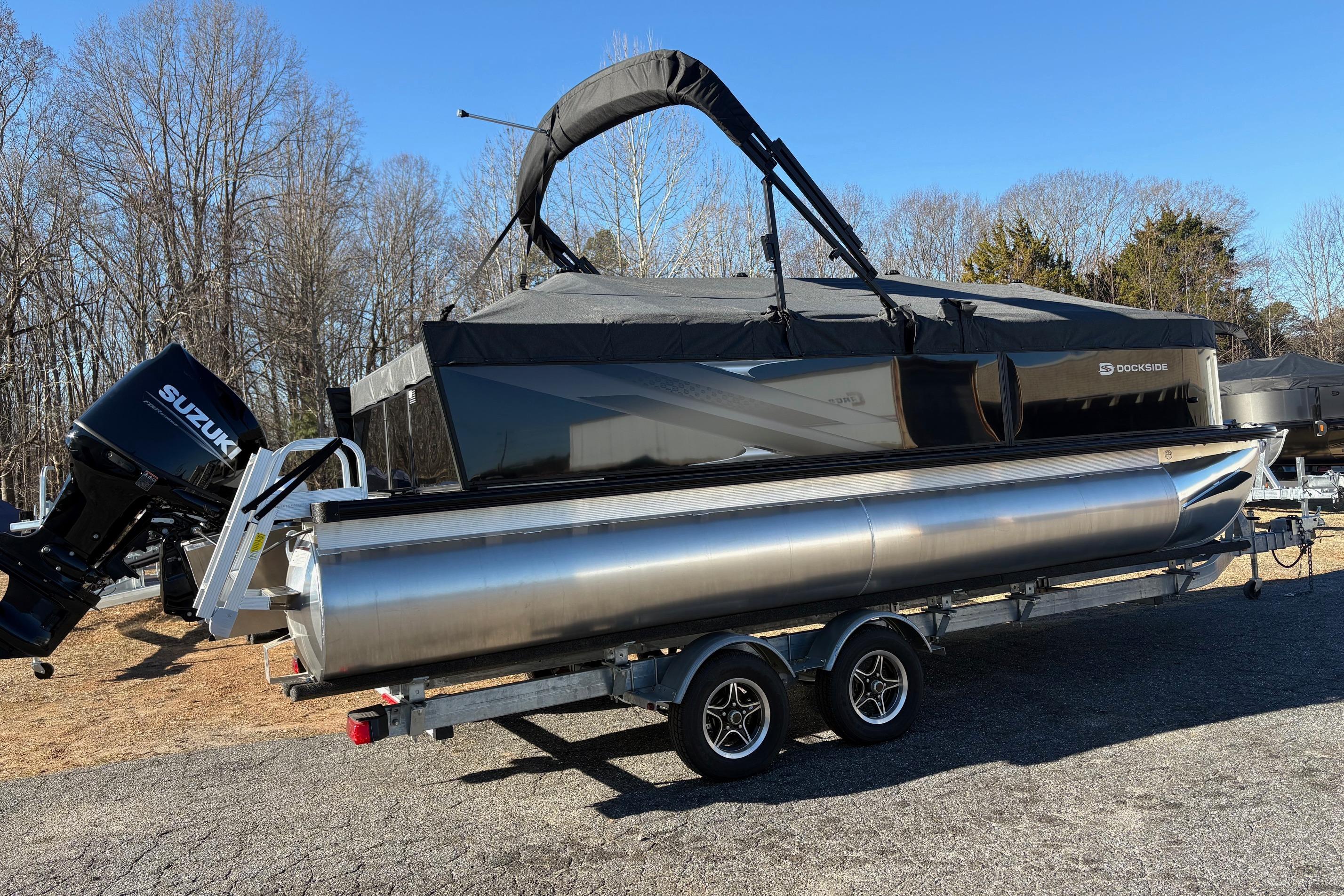 2026 Dockside 22DQ pontoon boat on trailer with Suzuki outboard motor.
