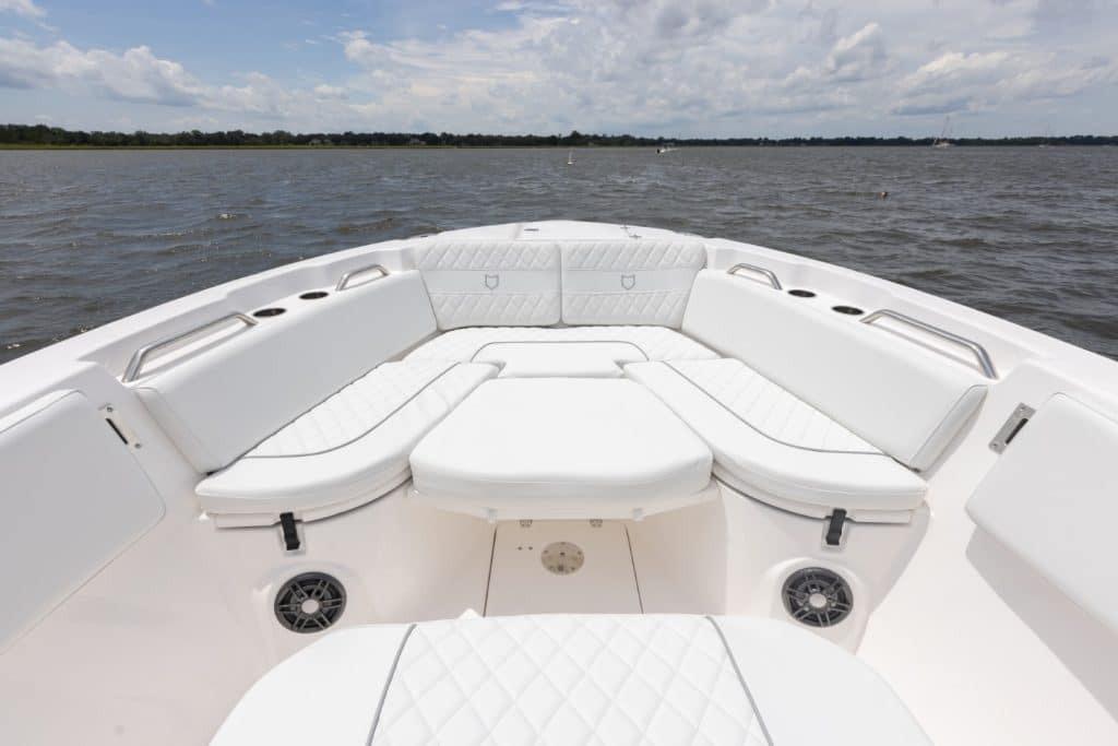 2027 Sea Fox 268 Commander boat with spacious white seating on open water.