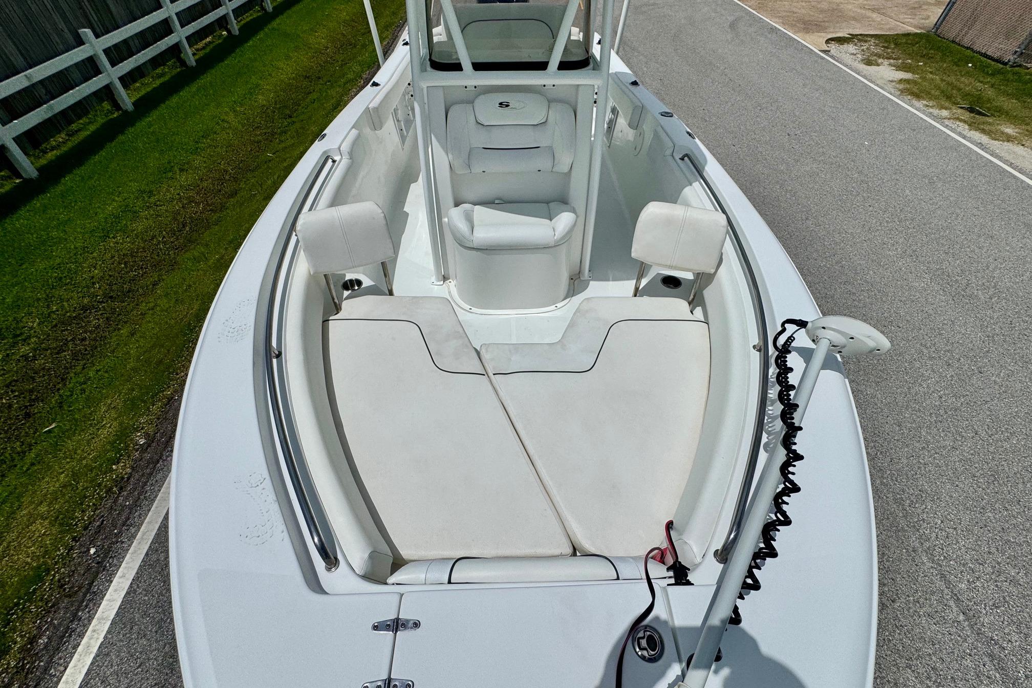 2015 Sea Hunt Ultra 234 boat interior with seating and clean deck.