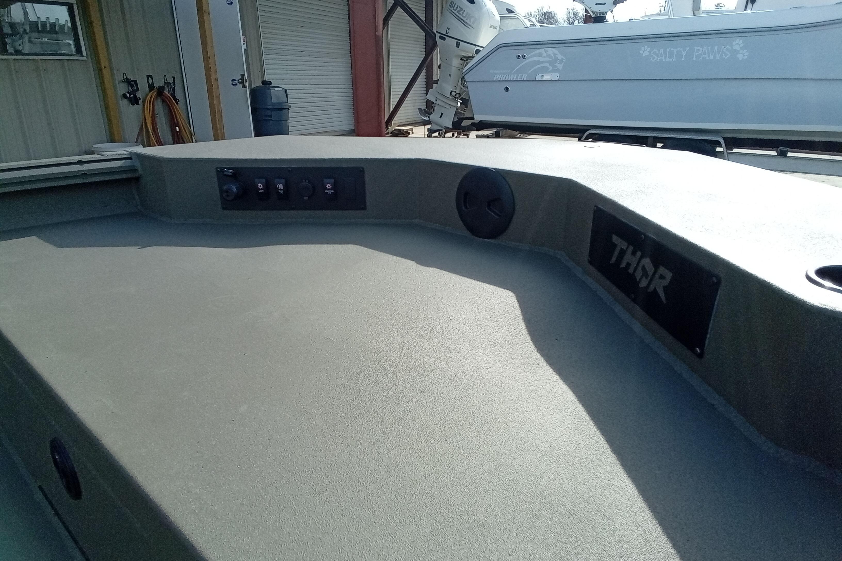 2026 Thor 1900 Low Country Elite boat deck with control panel and branding.