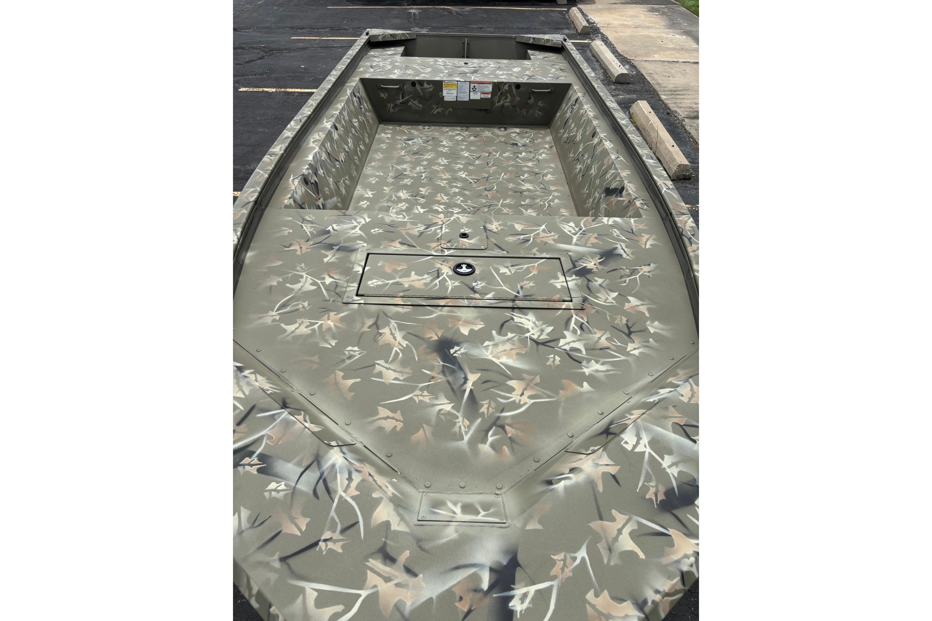 2025 Tracker Grizzly 1648 Jon boat with camouflage interior design.