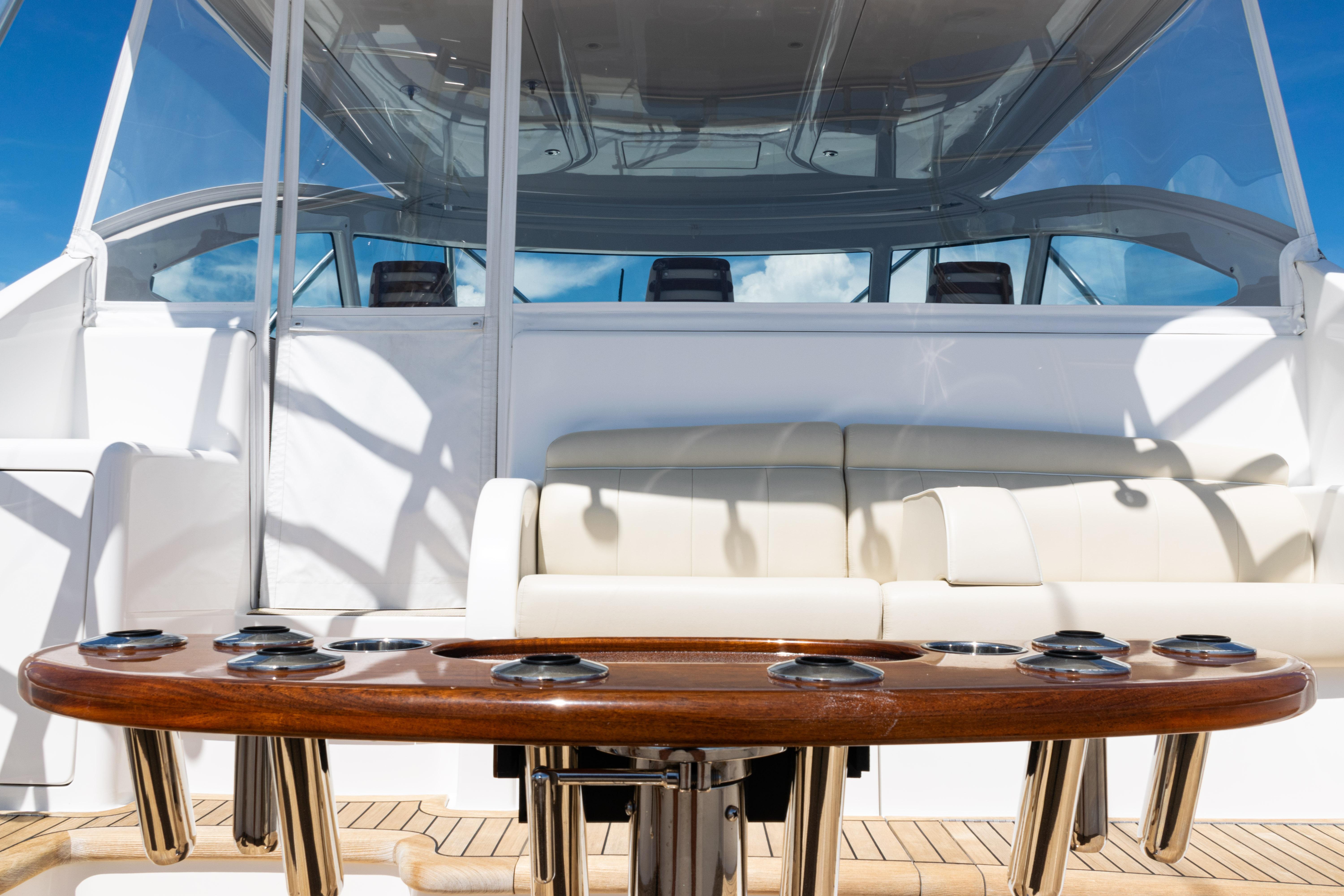 2021 Viking 44 Open yacht interior with luxurious seating and polished wood table.