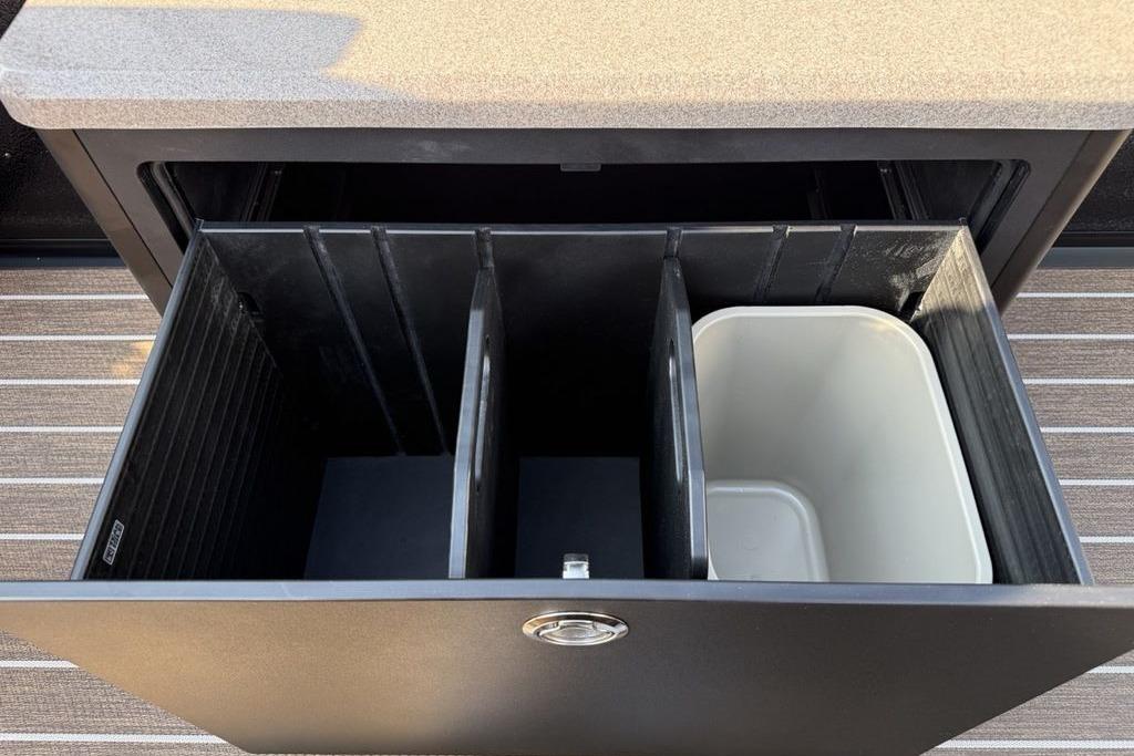 Storage compartment with dividers in a 2026 Premier 250 Solaris RS CL boat.