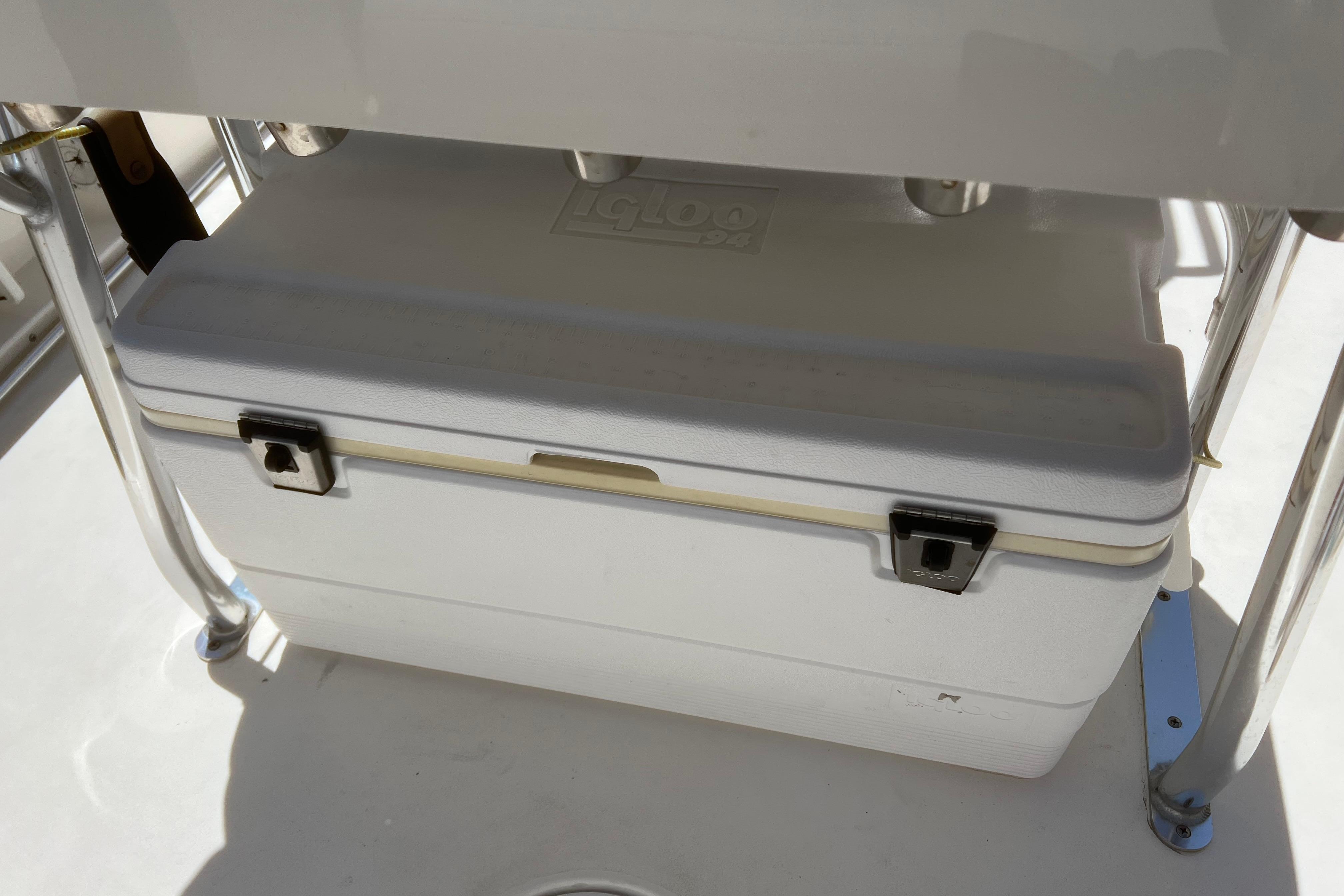 White cooler on a 2018 Cobia 201 Center Console boat deck.