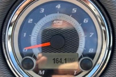 Close-up of a 2014 Yamaha Boats 212X tachometer displaying 164.1 engine hours.
