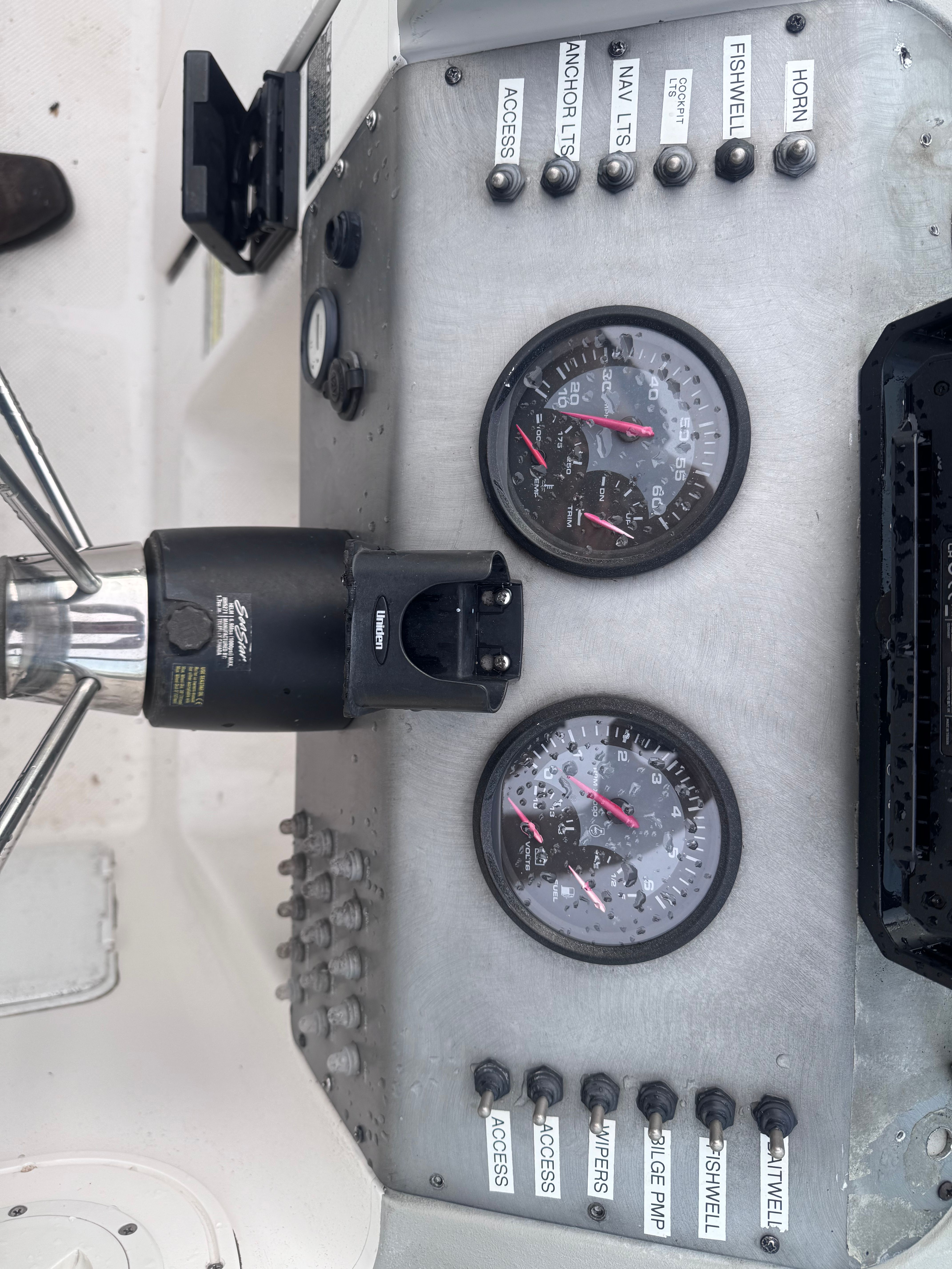 Dashboard of a 2005 Bayliner Trophy boat with instruments.