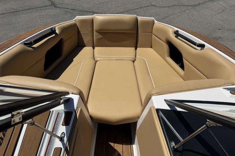 2023 Moomba Mojo Pro boat interior with tan seating and sleek design.