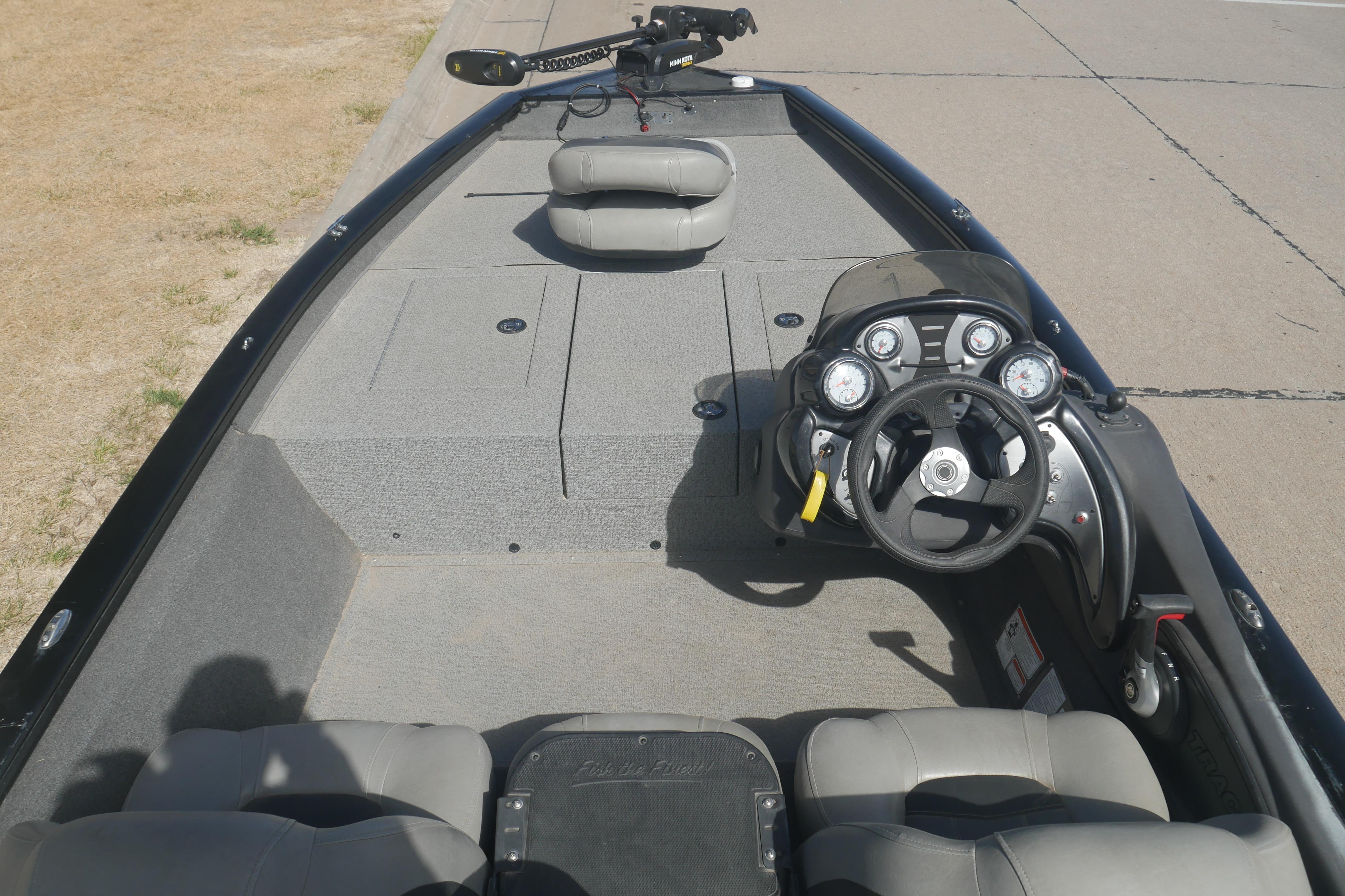 2018 Tracker Pro Team 175 TXW boat interior with steering console and seating.
