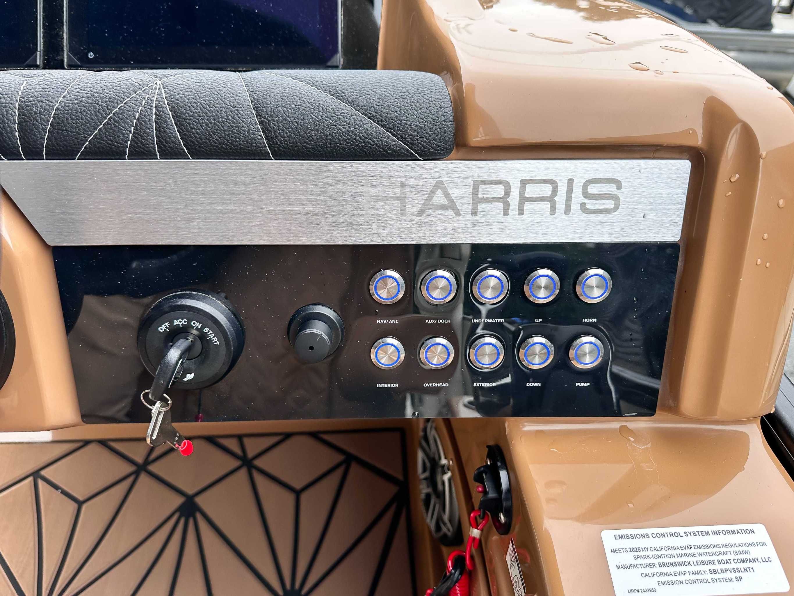 Dashboard of 2025 Harris Grand Mariner 230 SLDH with switches and ignition key.