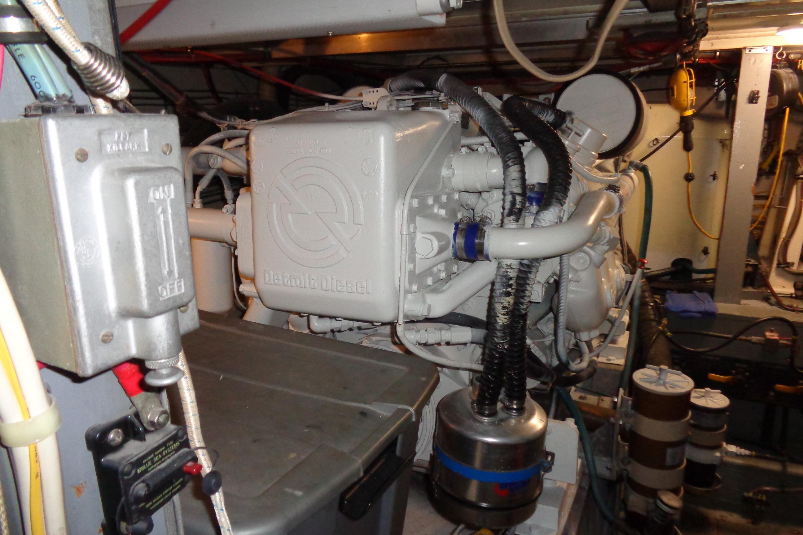 Engine room of 1981 Hatteras 48 Cockpit Motor Yacht with diesel engine components.