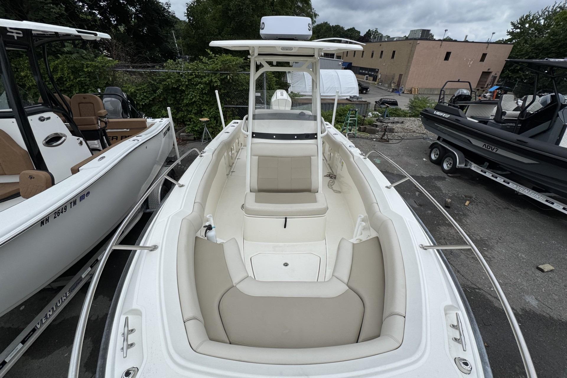 2024 Boston Whaler 230 Outrage boat, featuring spacious seating and sleek design.