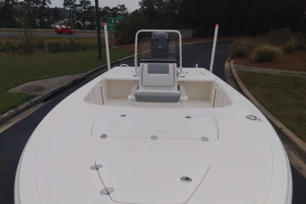 2026 Mako 18 Pro Skiff boat on a road, front view.