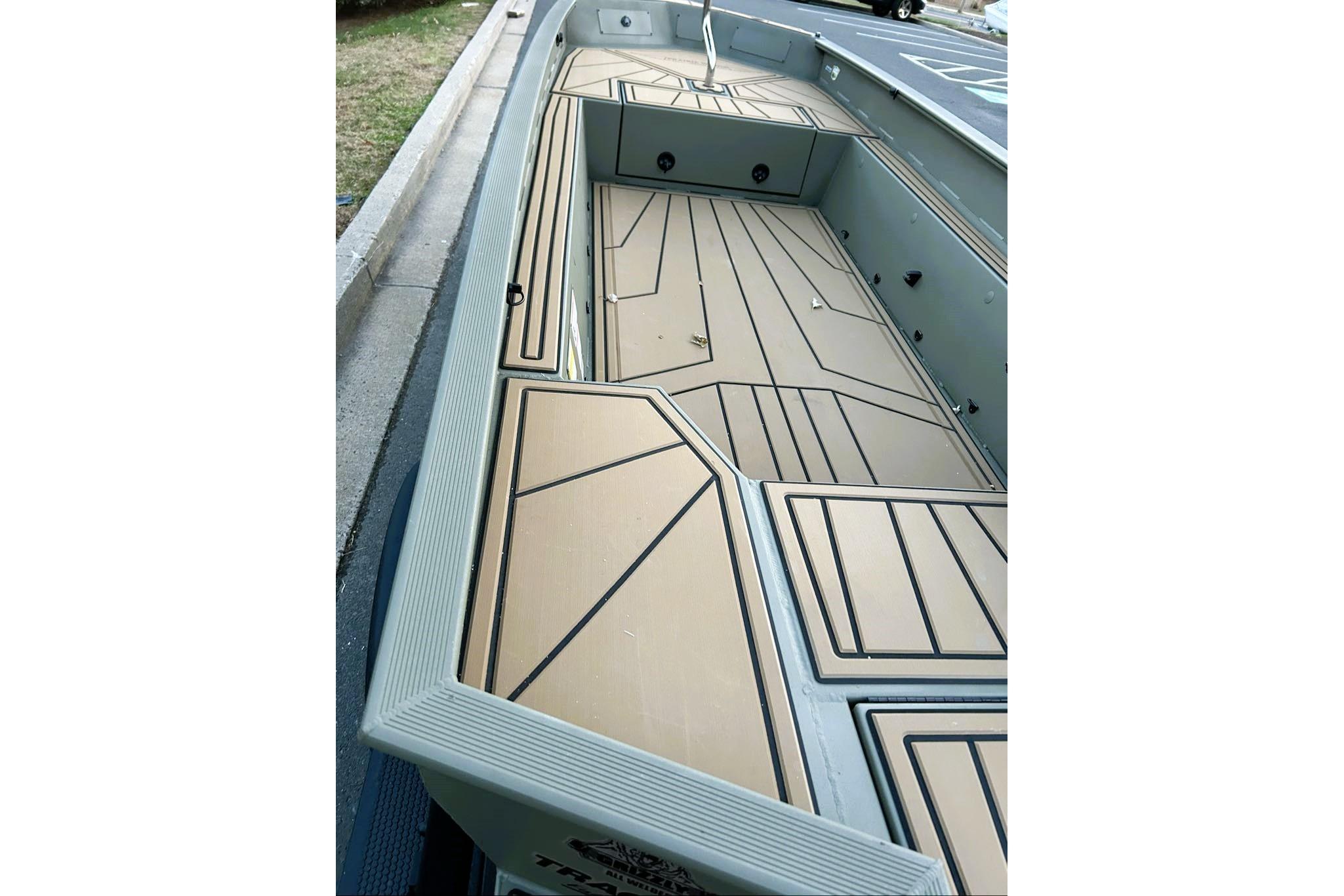 2026 Tracker Grizzly 1650 T Prairie Wings Edition boat interior with tan and black deck design.