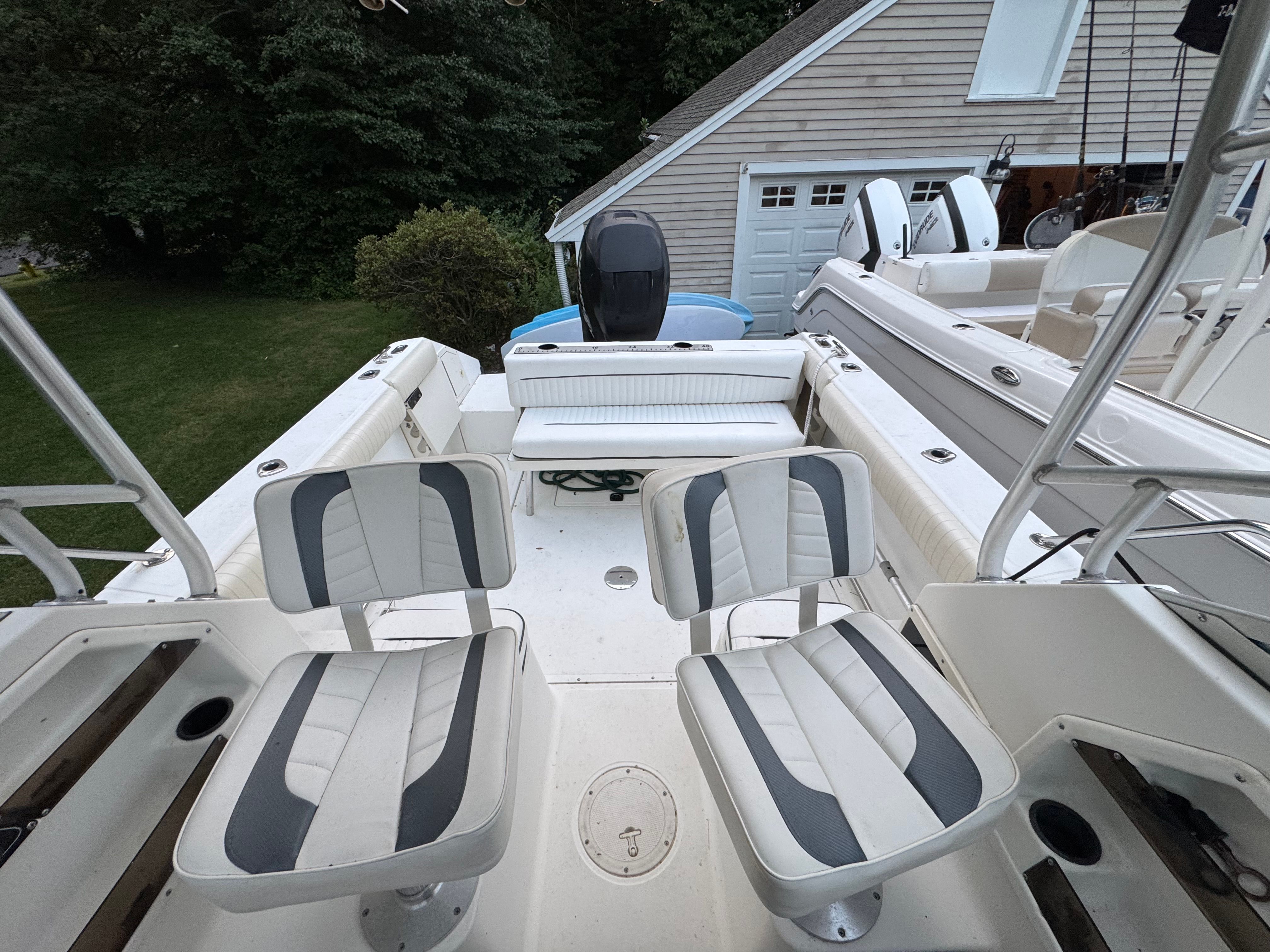 Boston Whaler Conquest 2000 with two seats and motor view.