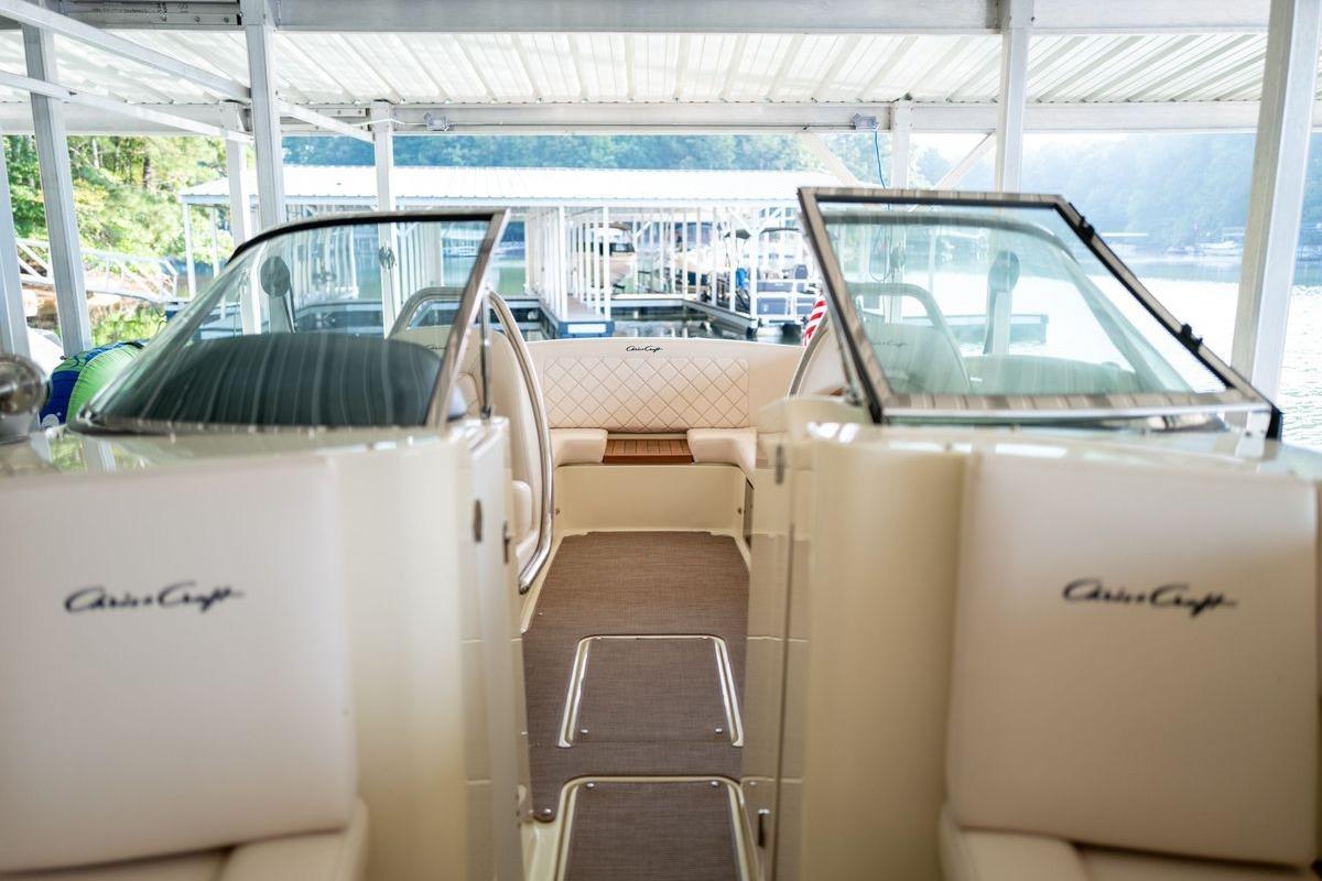 2023 Chris-Craft Launch 27 boat interior with elegant seating and windshield.