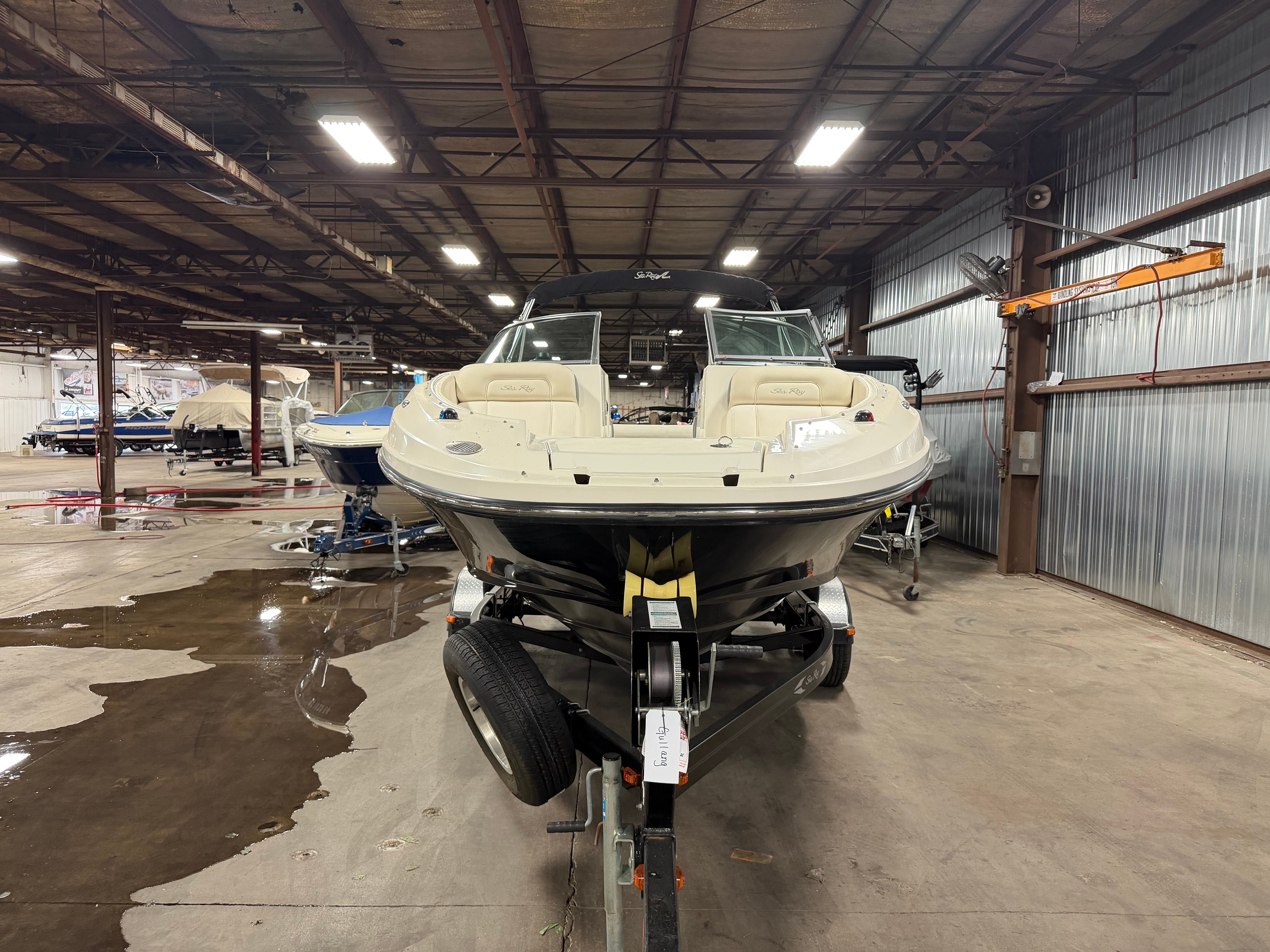 2012 Sea Ray 220 Sundeck boat in warehouse.