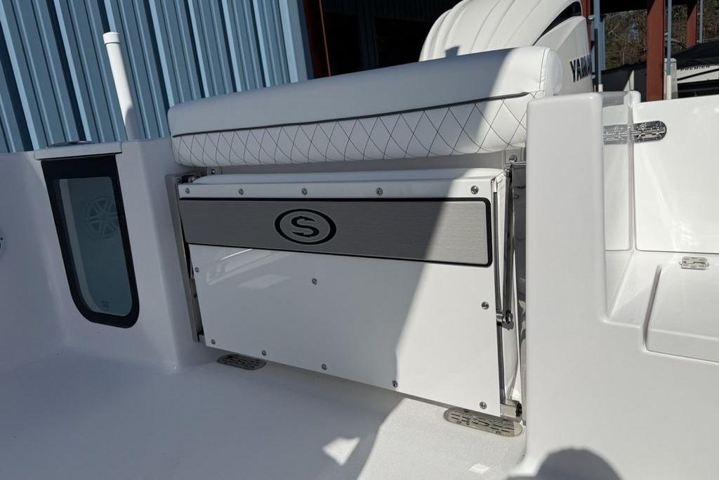 2026 Sportsman Open 232 Center Console boat interior with seating and storage.