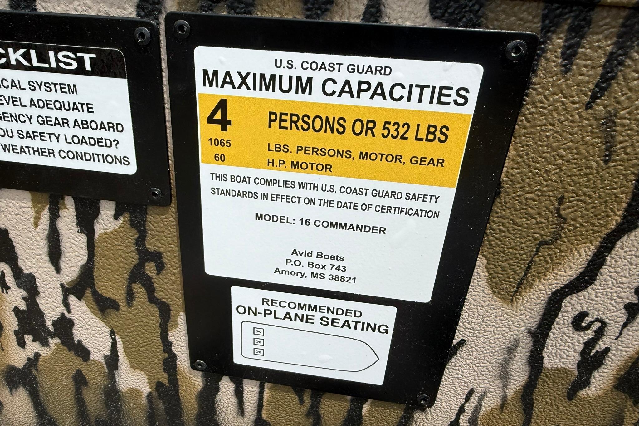 U.S. Coast Guard capacity label on Avid 16 Commander boat, 2026 model.